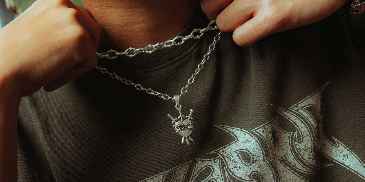 sterling silver necklaces on male model neck by statement collective