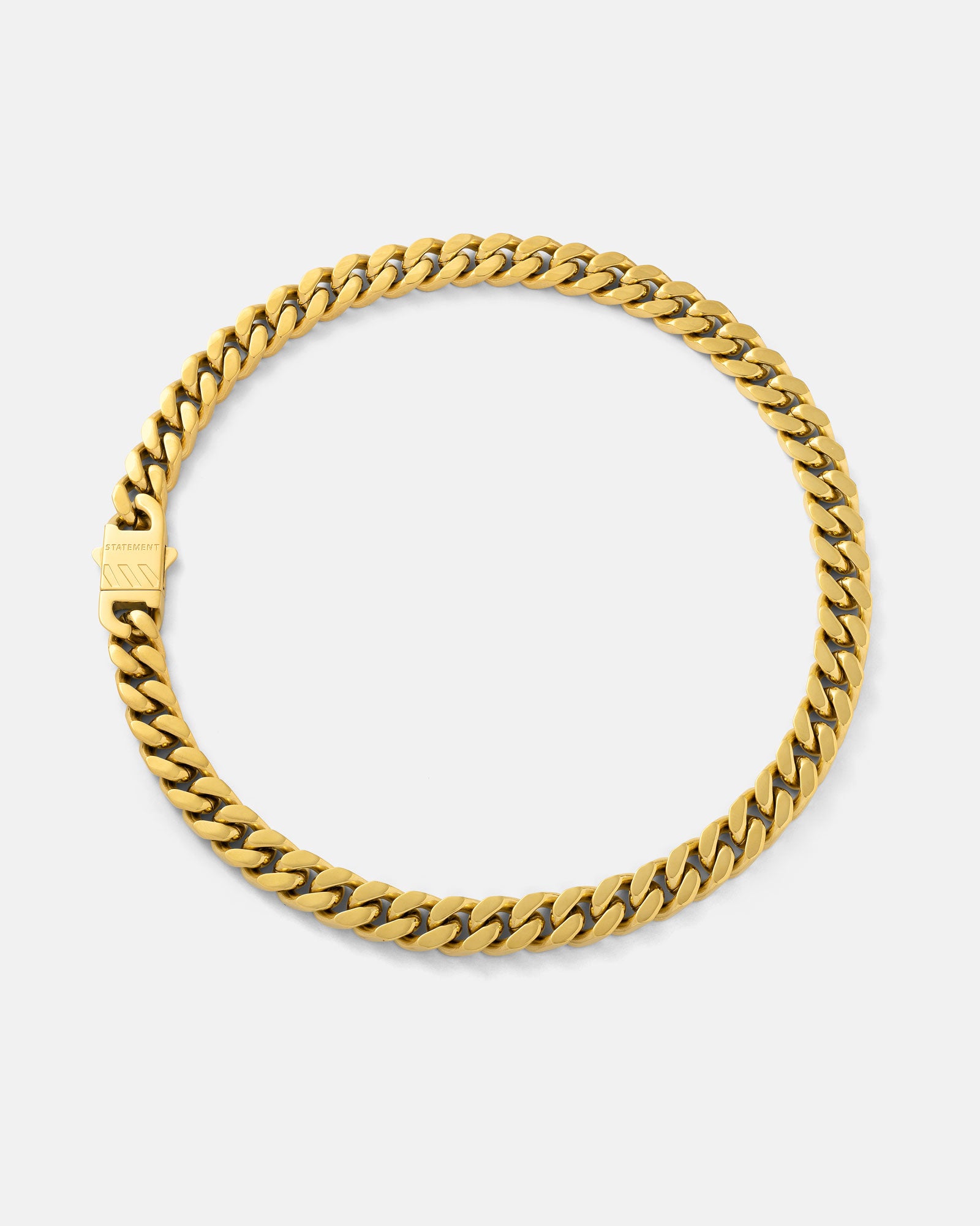 The 11mm Cuban Chain (Gold) features flat, interlocking links and a rectangular clasp. It's 18k gold plated for a non-tarnish, waterproof finish, and is shown in a circular shape on a plain white background.