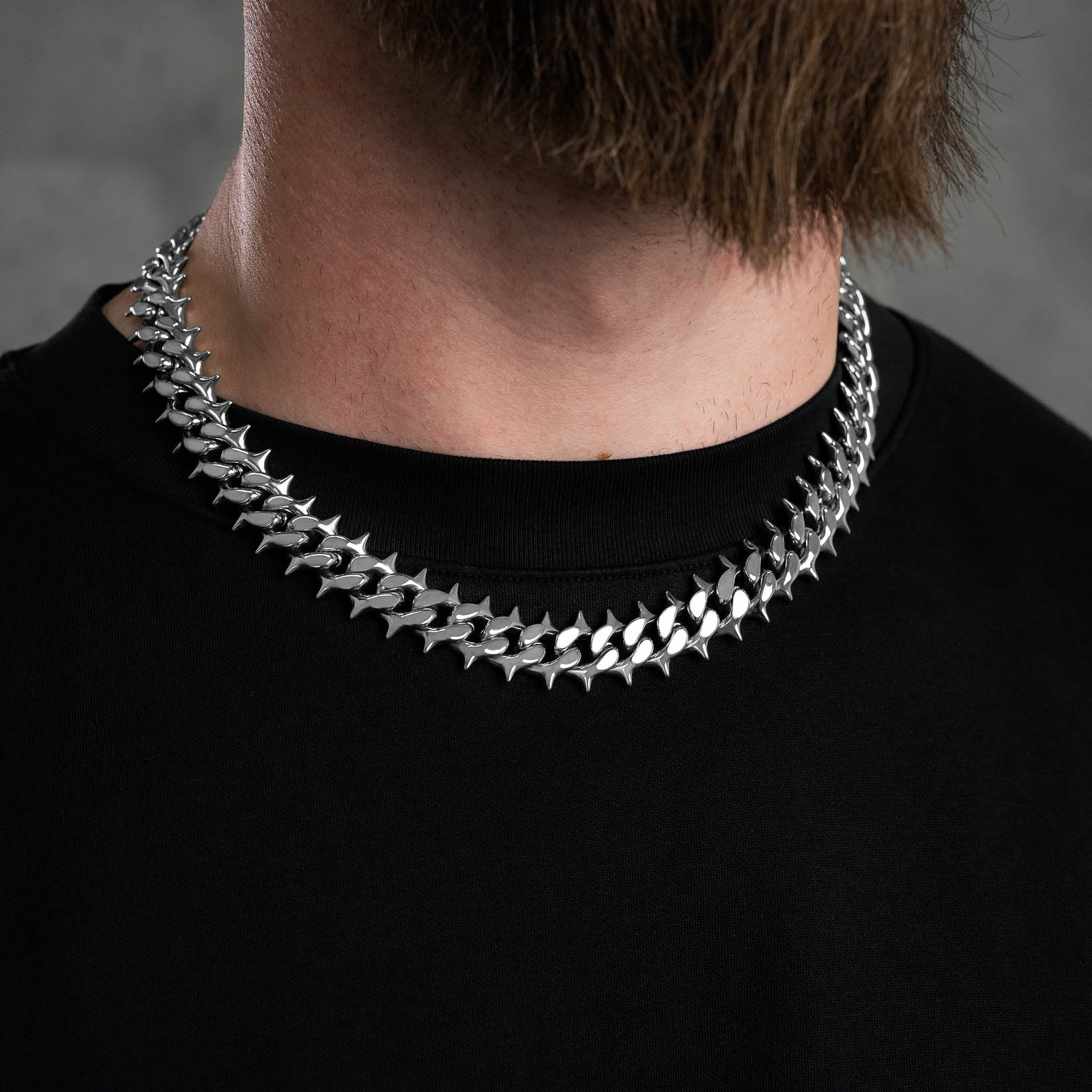 spiked cuban link chain silver on mens neck by statement