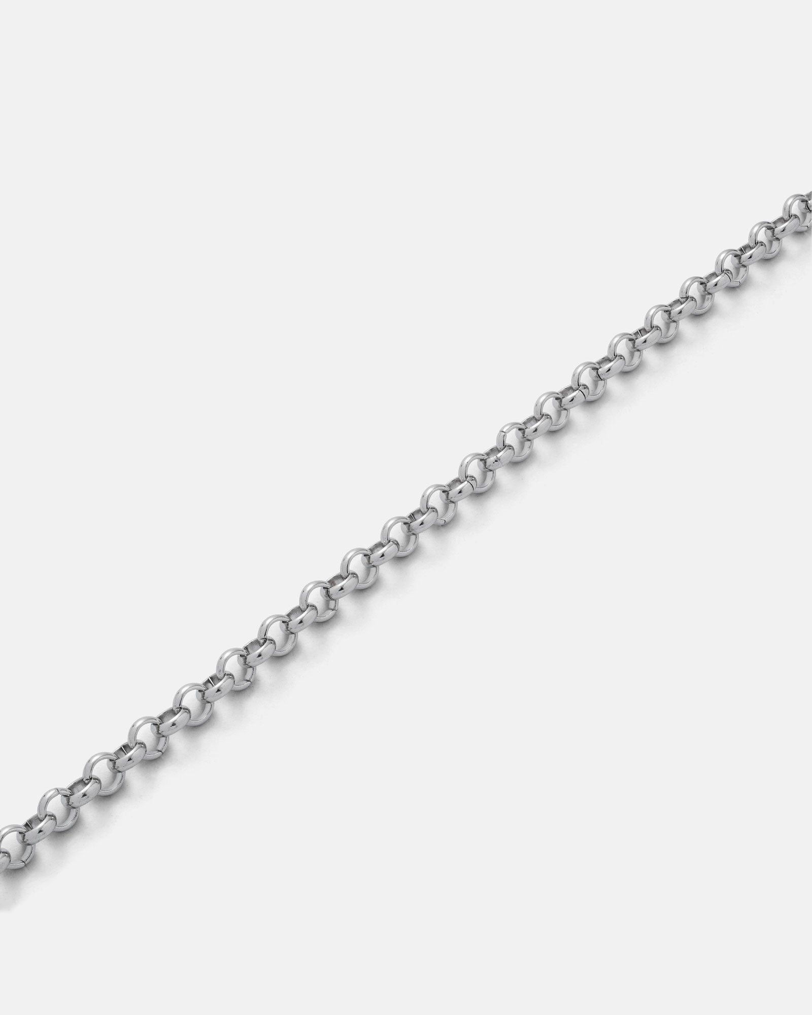 A close-up of the 5mm Rolo Chain, displayed diagonally on a plain white background. This non-tarnish stainless steel necklace features small round links, creating a classic and timeless style.