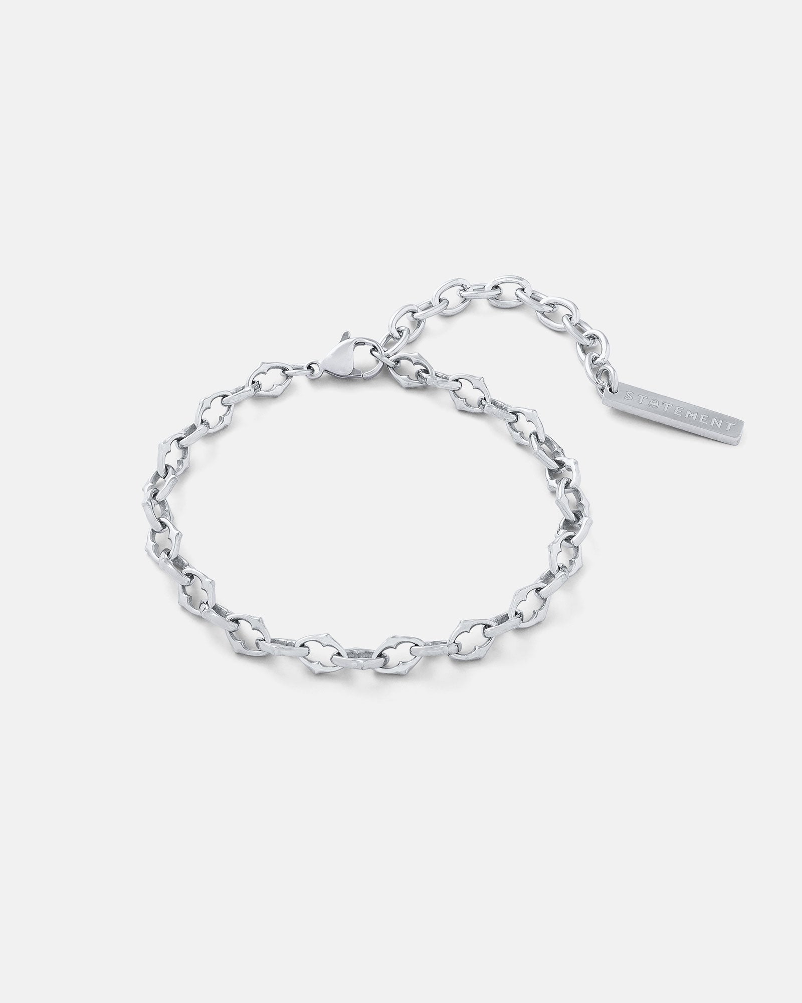 Silver 6mm Spiked chain link bracelet by statement collective on grey background