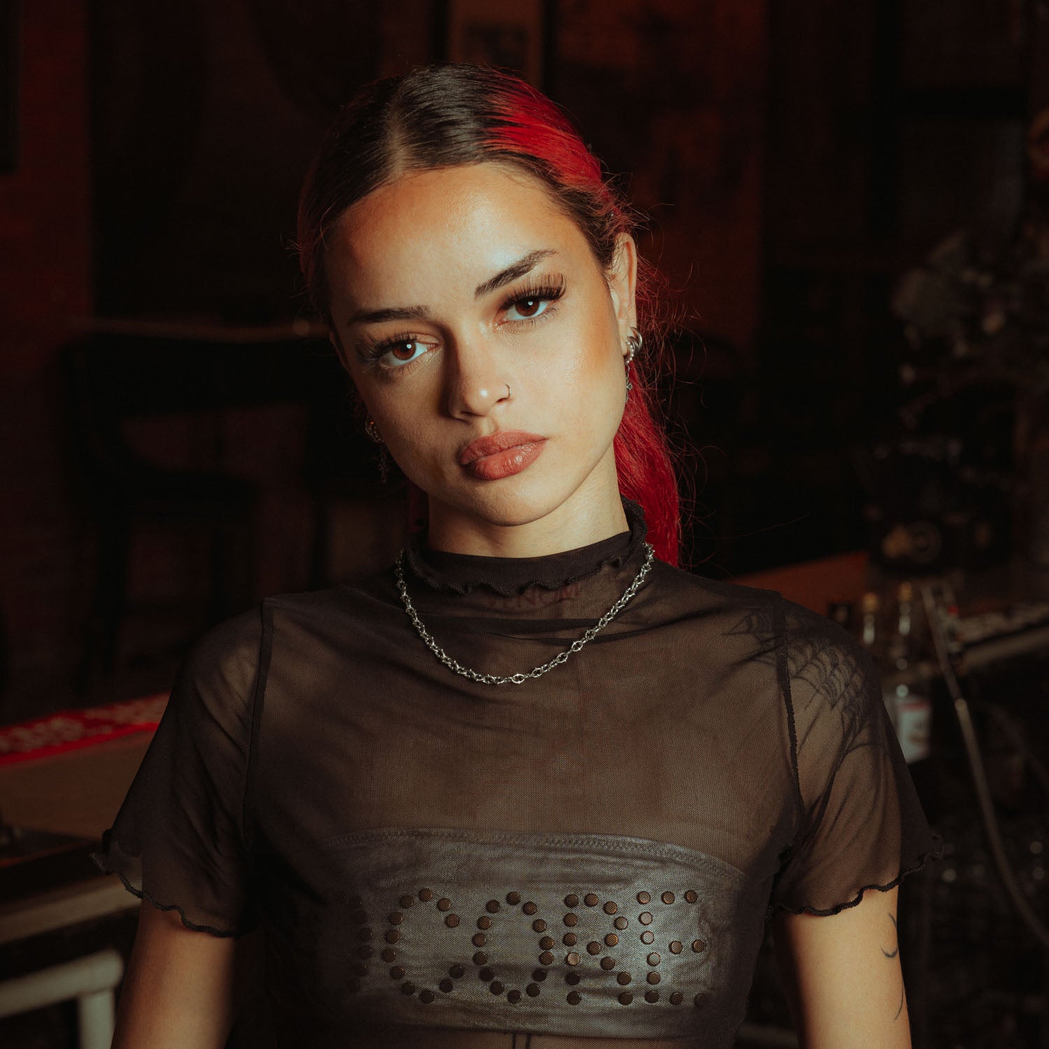 6mm spiked chain in sterling silver on female model with red hair and mesh shirt