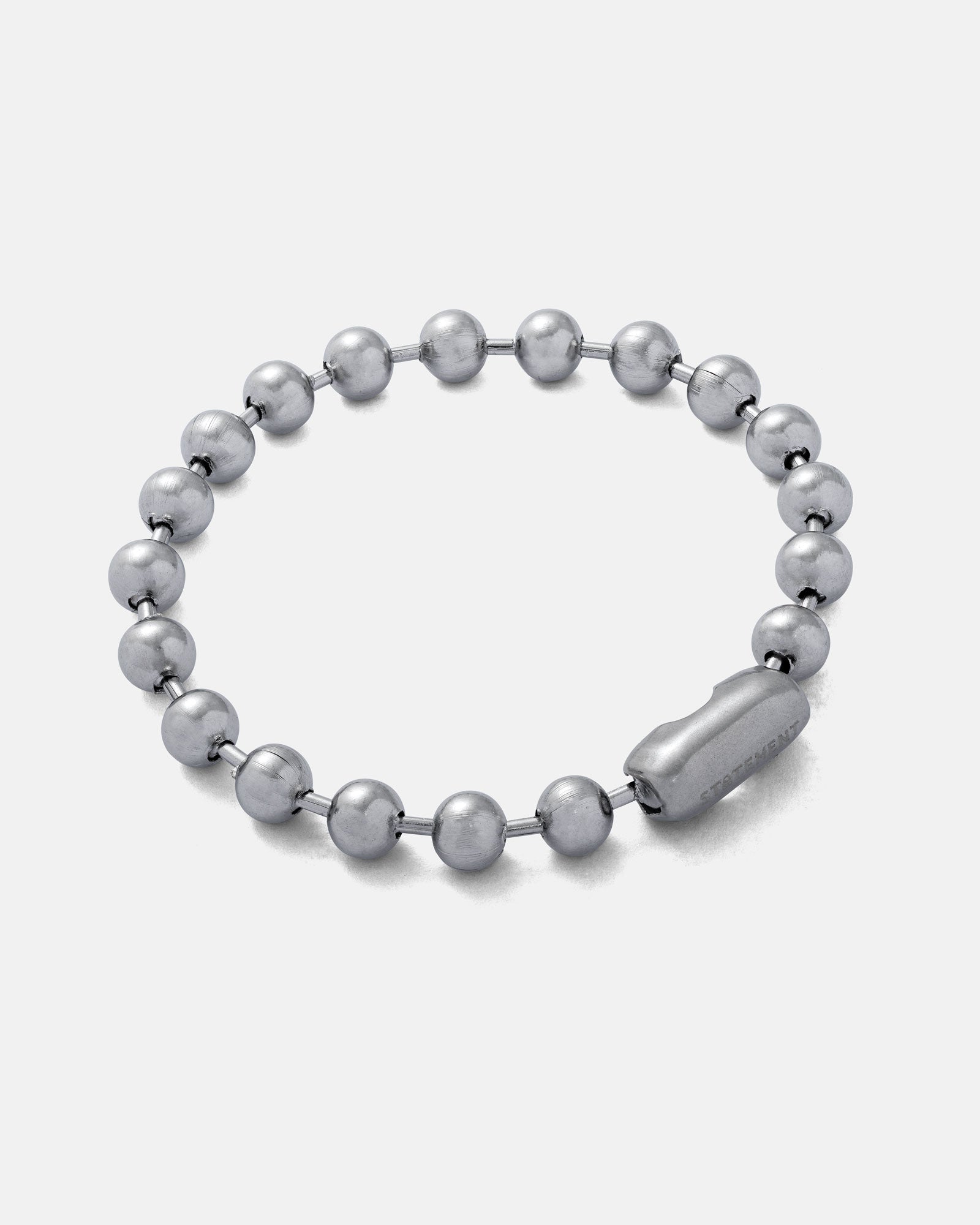 Silver 7mm Ball chain bracelet by statement collective on grey background.