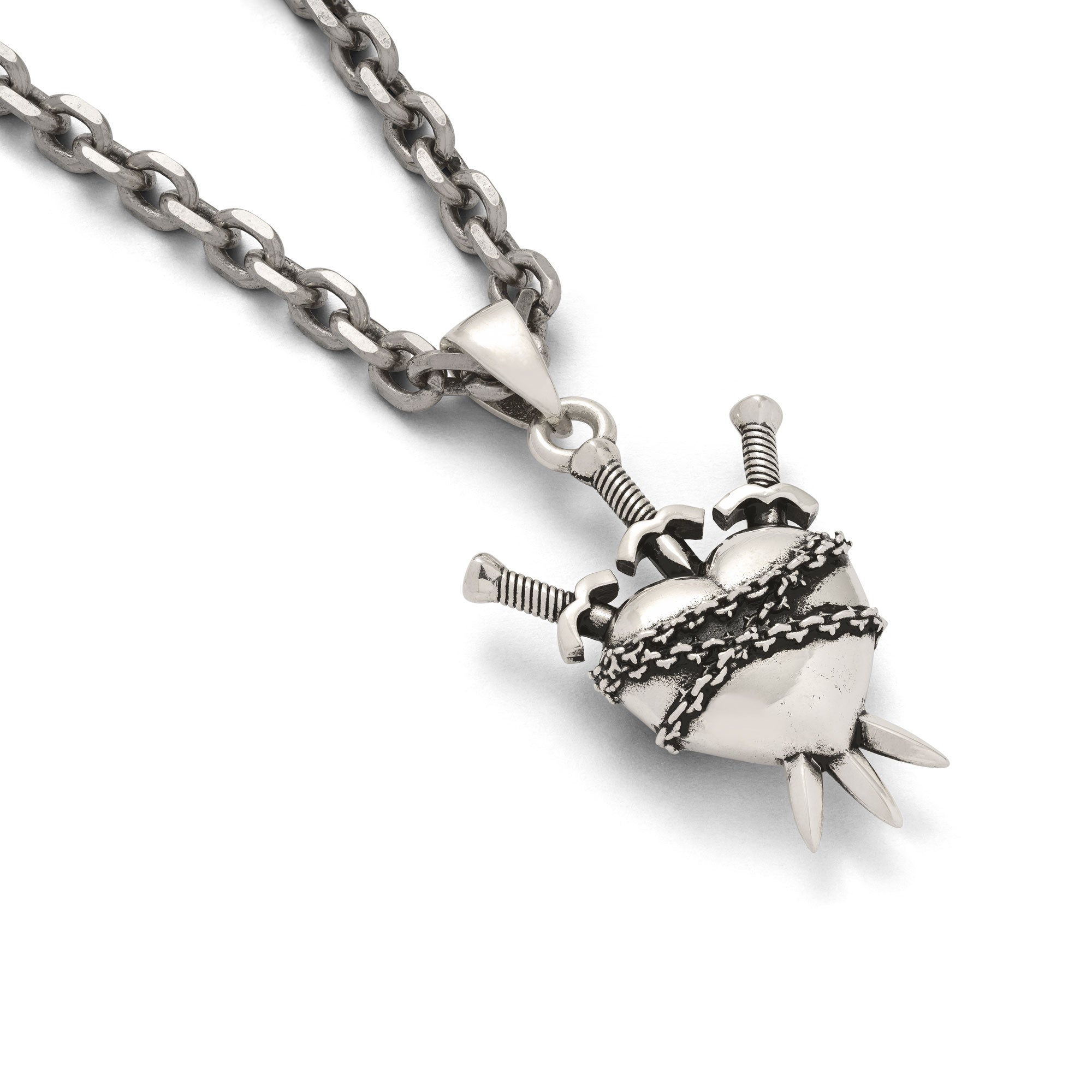 Sterling Silver heart-shaped pendant with chain and spikes on a white background