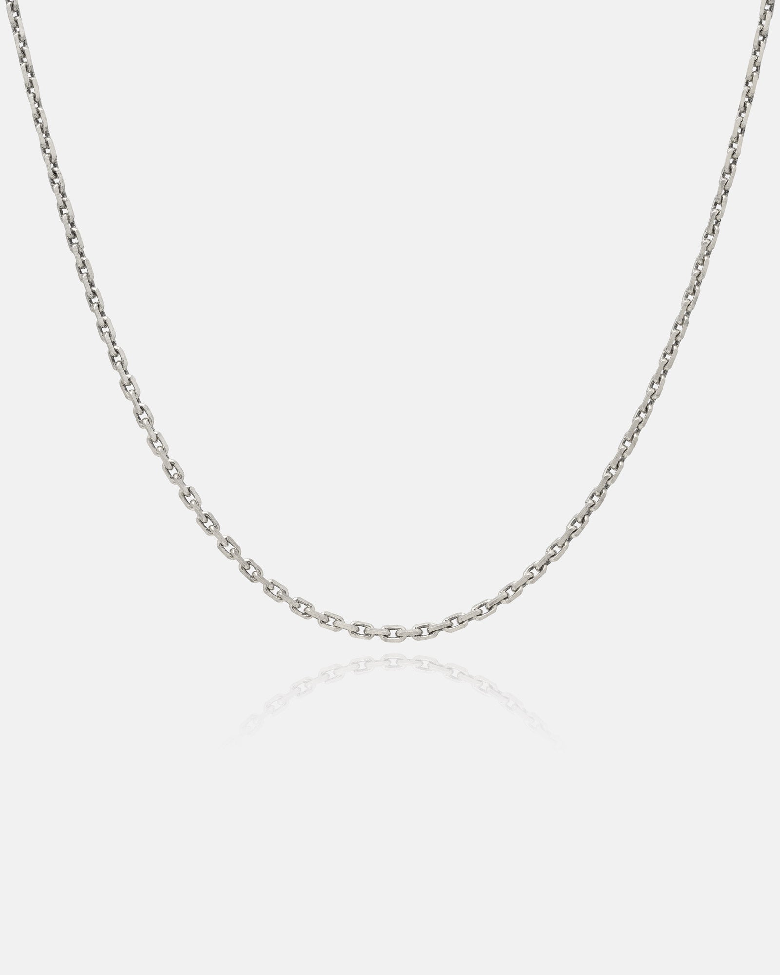 Sterling silver 3mm cable chain on grey background