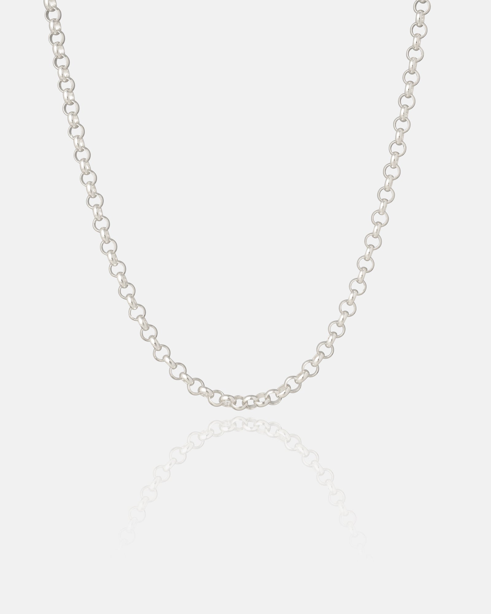 A Statement Collective 925 Sterling Silver 4mm Rolo Chain is displayed on a plain white background, with its reflection visible below.