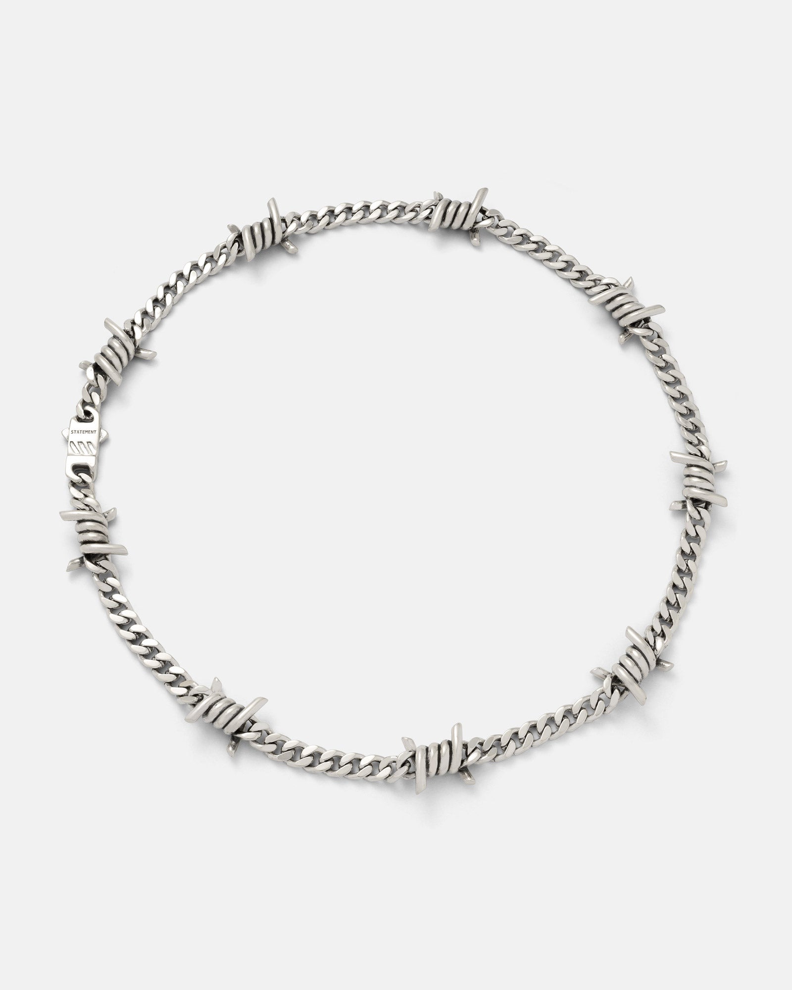 6mm cuban chain with barbed wire pendants on grey background