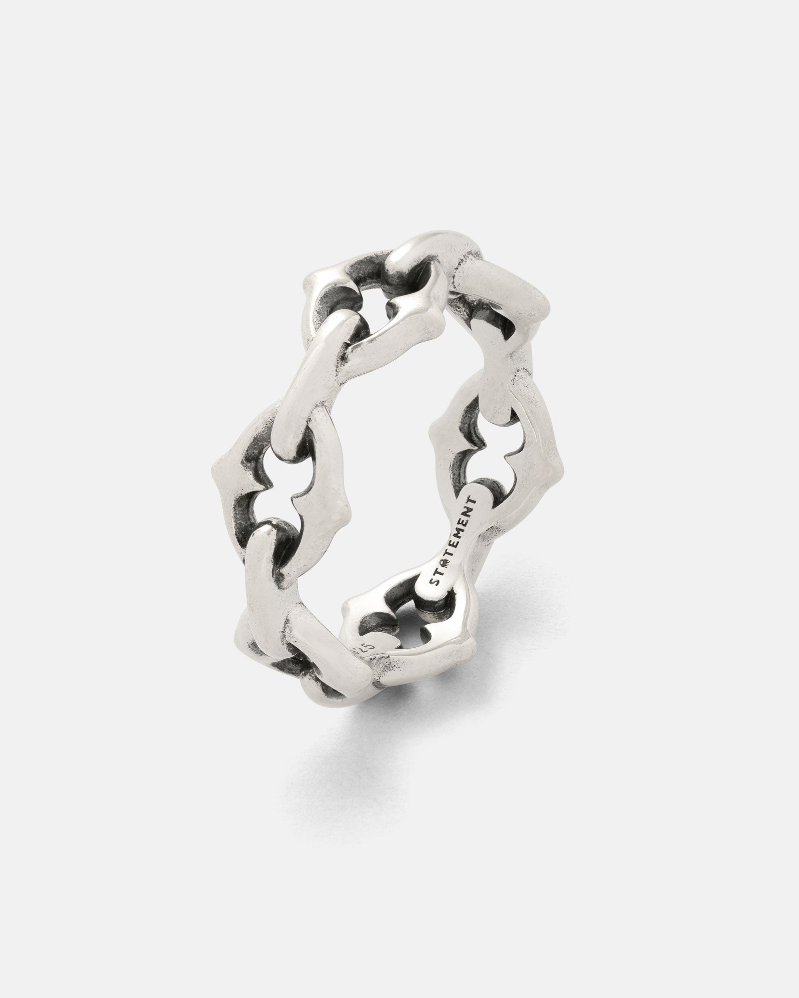 The 925 Sterling Silver "The Cathedral" Spiked Ring features interconnected geometric links with star-shaped cutouts, a slightly oxidized finish, and "STREETWEAR" engraved on the inner band.