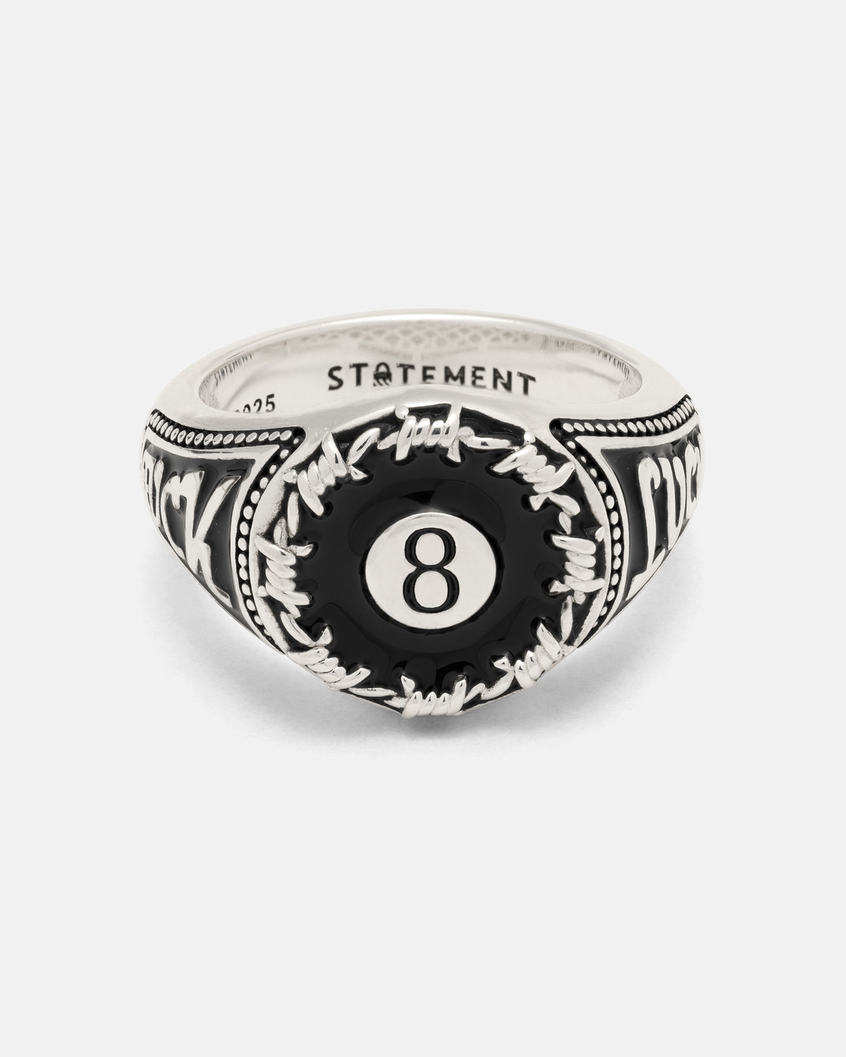 925 Sterling Silver Lucky Shot ring featuring a black 8-ball encircled by barbed wire detailing and engraved lettering on the sides.