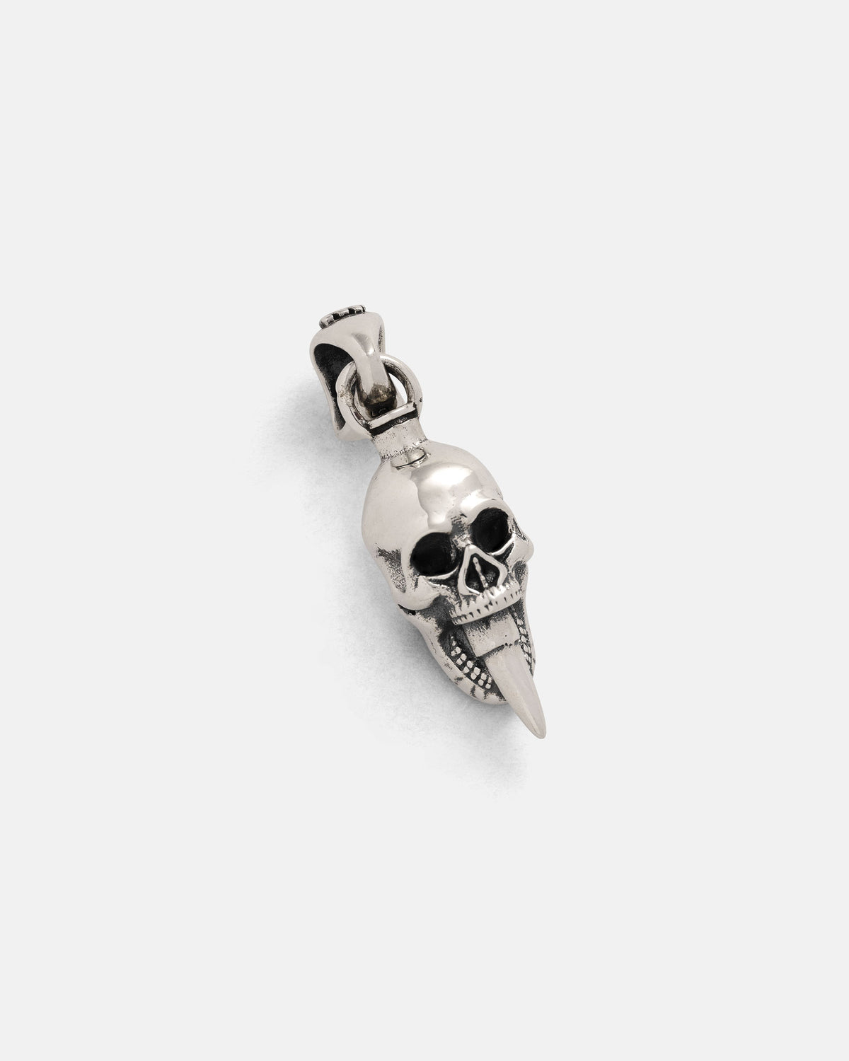Introducing the Statement Collective 925 Sterling Silver Mini "Bite the Bullet" Pendant—a striking skull pendant featuring a long, pointed fang, displayed on a plain white background. Perfect for those who appreciate distinctive rock-inspired jewelry.