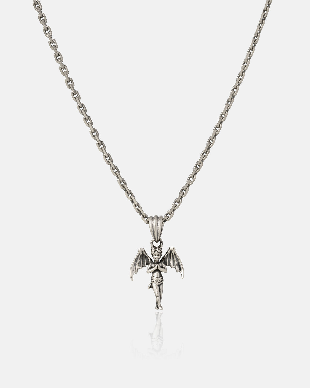 The Statement Collective 925 Sterling Silver "The Wicked One" Pendant—a striking chain necklace featuring a detailed angel design with outstretched wings and a sword—is displayed on a plain white background, making it an eye-catching addition to any jewelry collection.