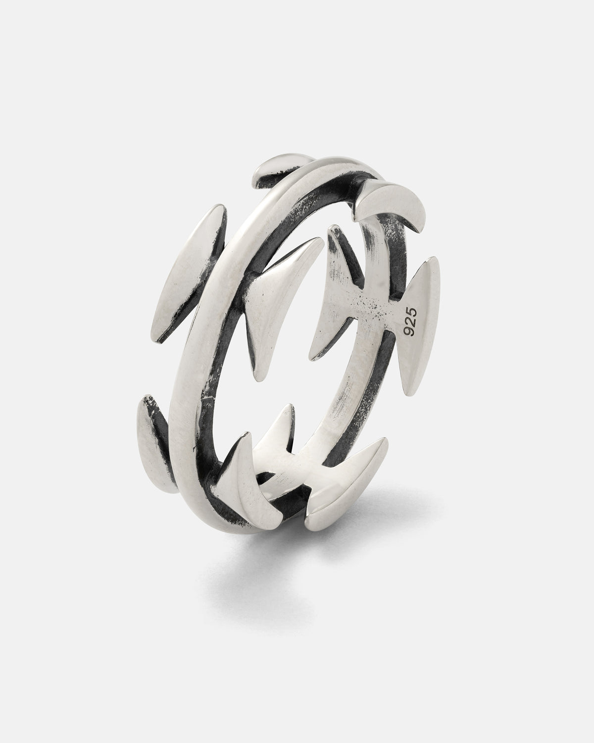 The Statement Collective 925 Sterling Silver Razor Wire Ring showcases bold, tattoo-inspired style with a unique open design, accented by pointed spike-like protrusions around the band and a subtle 925 engraving on the inside.
