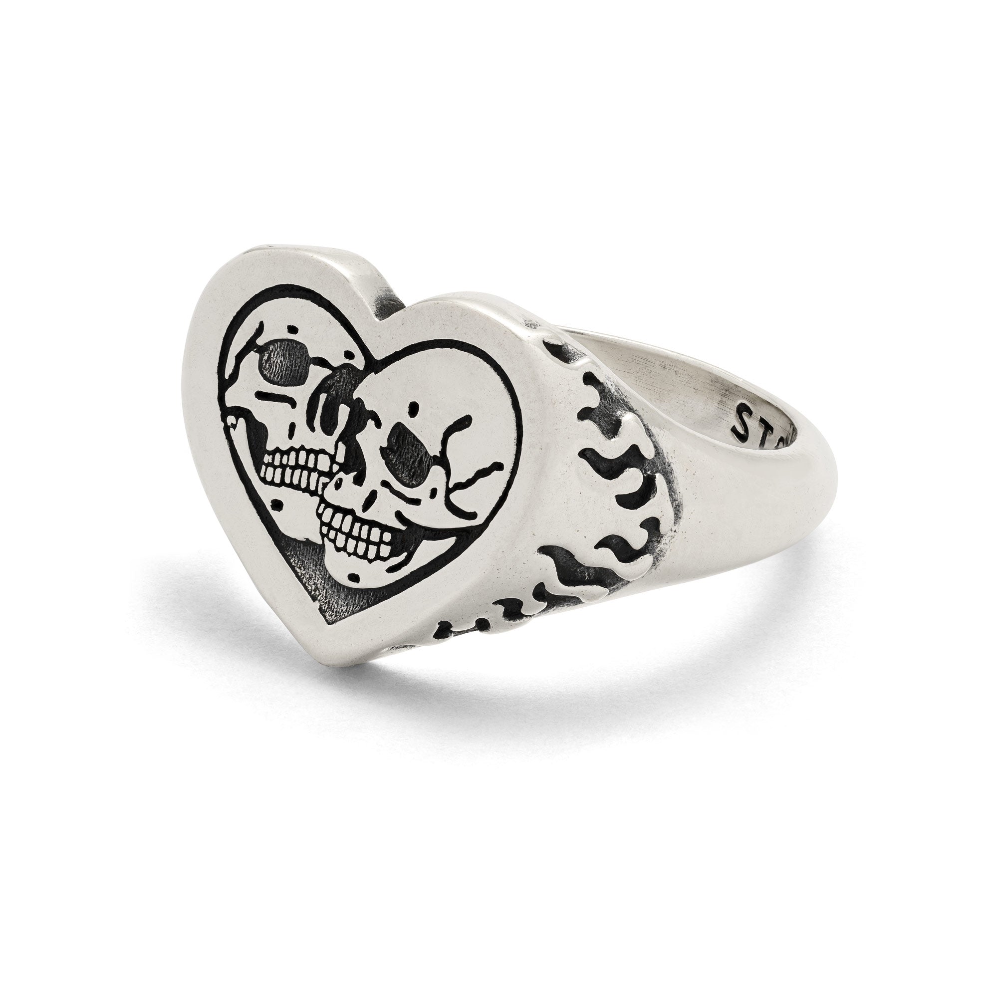 Sterling Silver heart-shaped ring with skull design on a white background