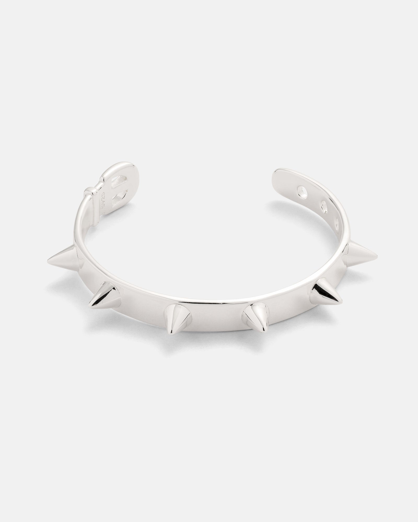 The Statement Collective 925 Sterling Silver Spiked Cuff Bracelet is displayed on a plain white background, showcasing its evenly spaced, pointed spikes encircling the outer edge.