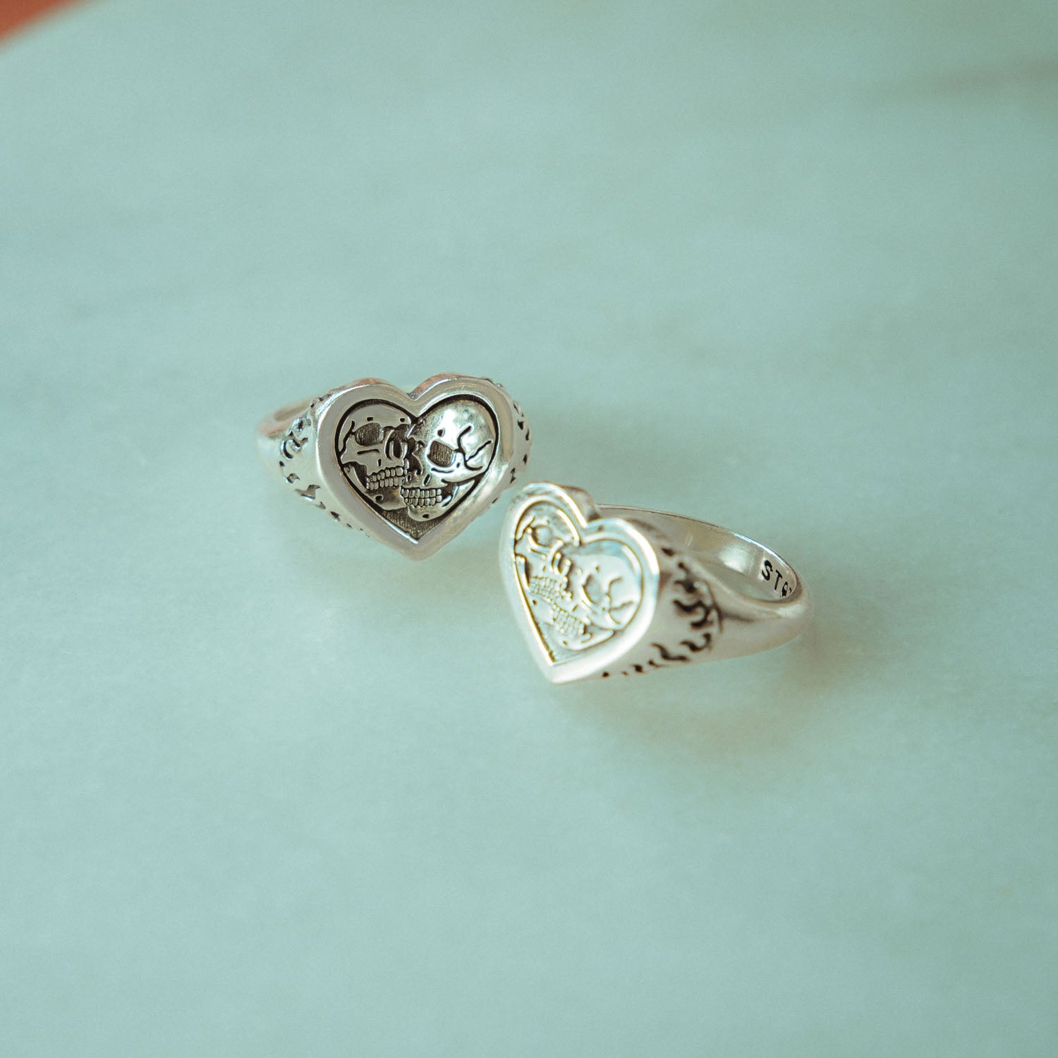 heart ring with skulls in sterling silver by statement collective