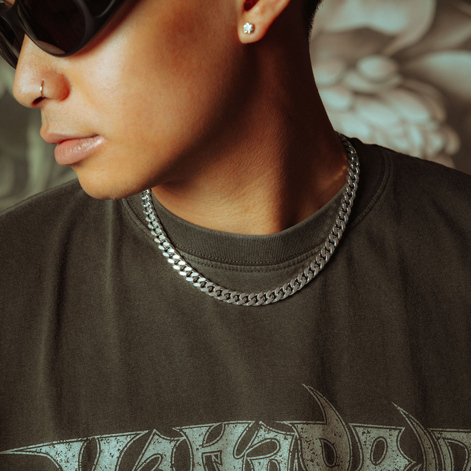 silver 9mm cuban chain on male model in sunglasses and grey shirt