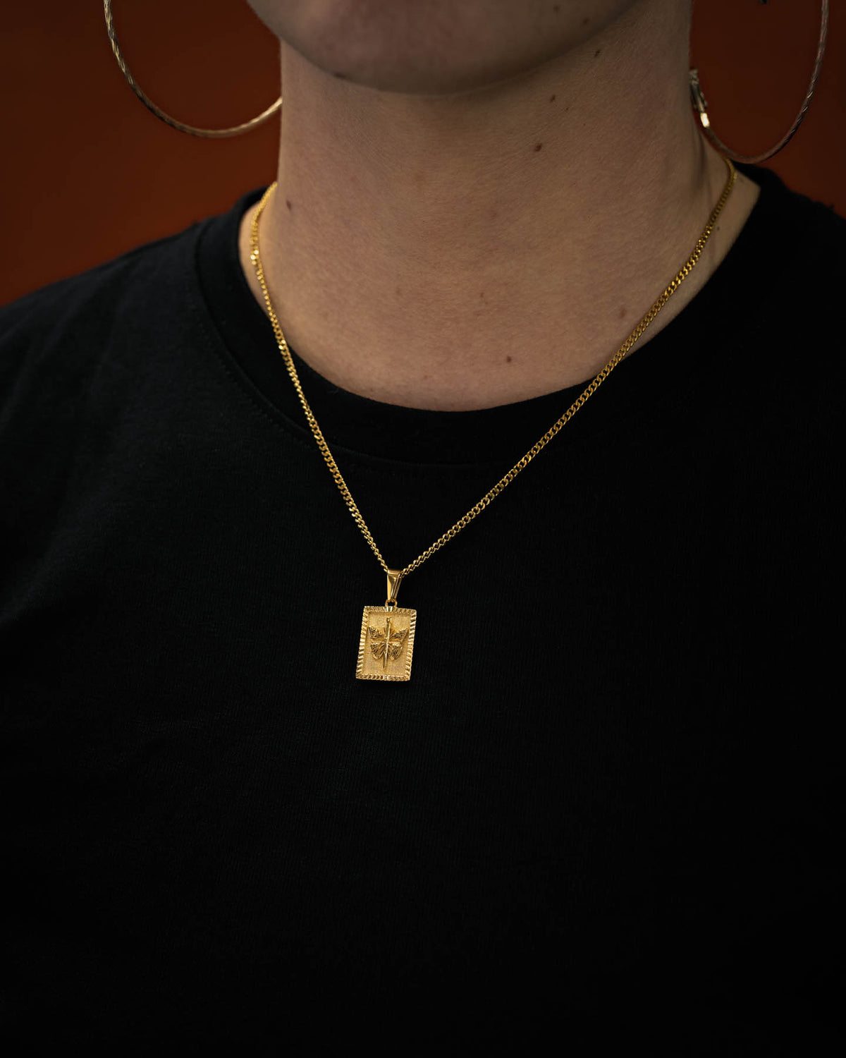 mini butterfly tag plated in 18k gold on womens neck