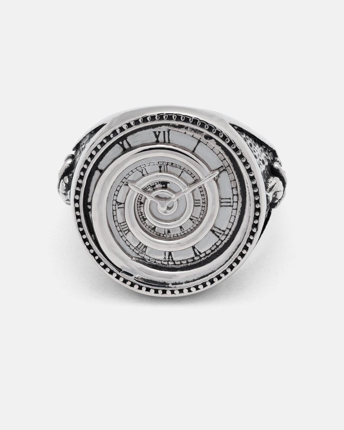 The Infinite Clock Ring by Statement Collective is a silver ring crafted with a detailed spiral clock face, Roman numerals, clock hands, and a mesmerizing spiral pattern at its center.