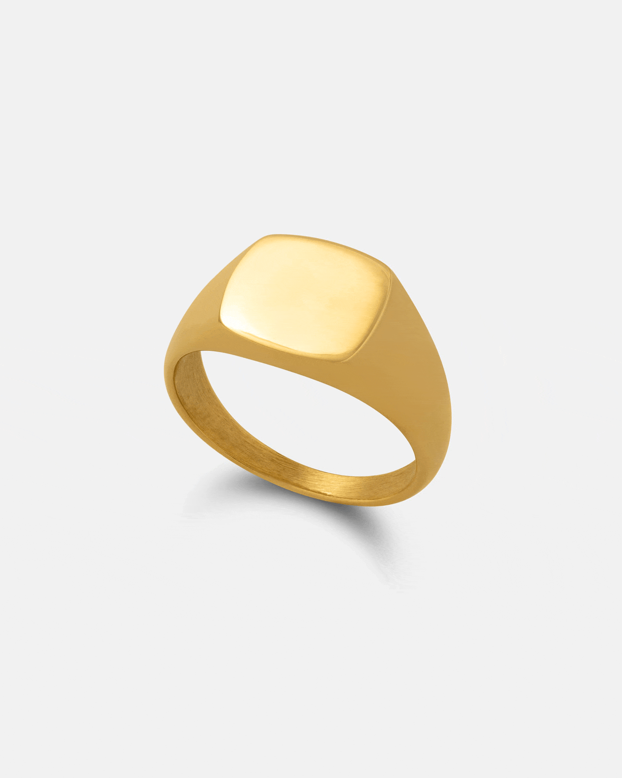 The Minimal Signet Ring (Gold) by Statement Collective is shown on a light gray background, featuring a smooth, flat square top and minimalist 18k gold design with a polished finish.