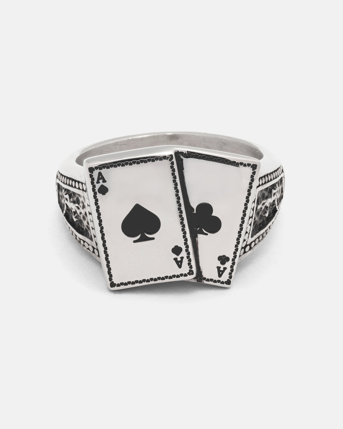 Pocket Aces Ring made of stainless steel, featuring two overlapping ace playing cards on the face with textured detailing along the macabre band.