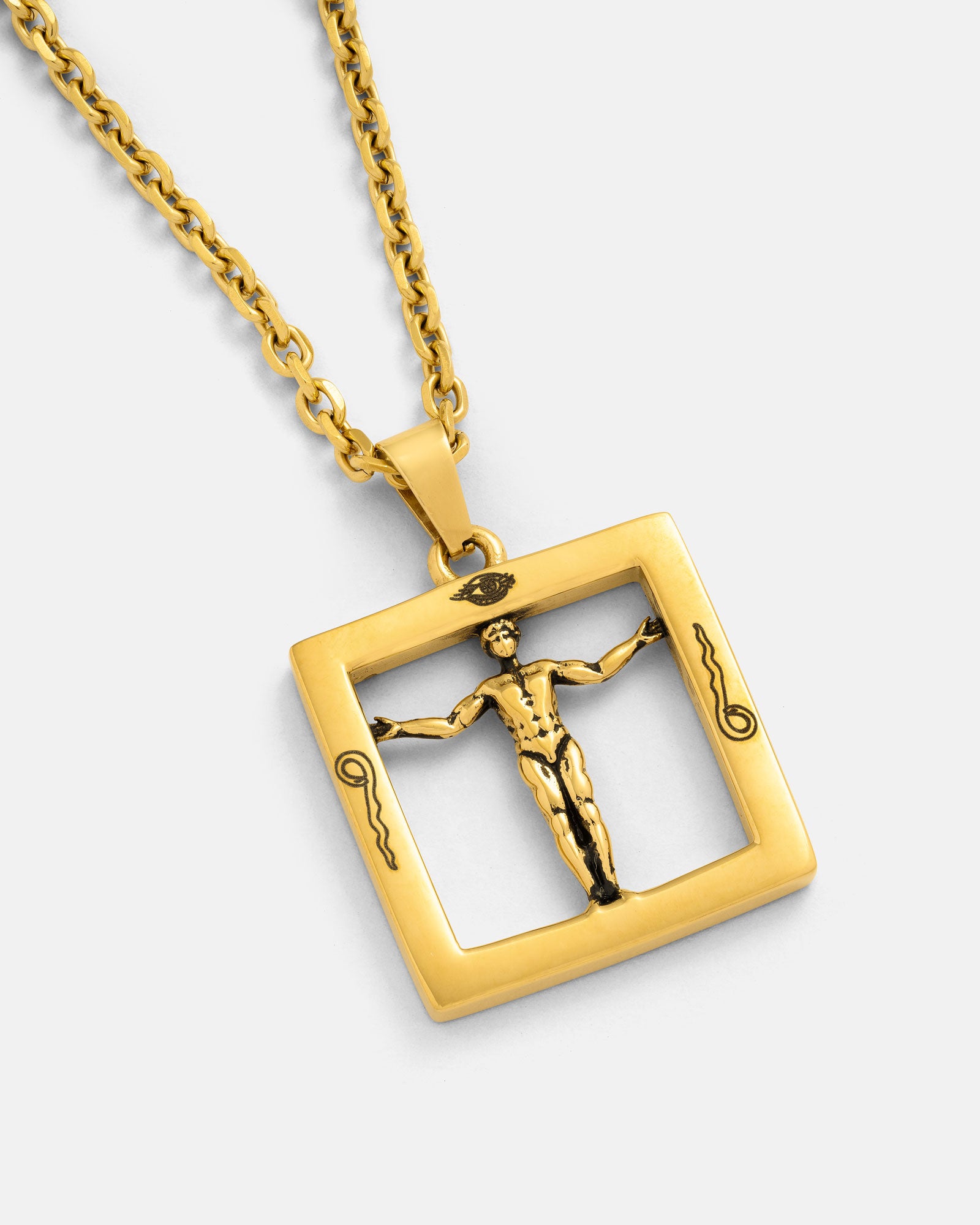 The Agrippa’s Square Pendant (Gold) is an 18k gold-plated necklace featuring a square charm with a raised, outstretched figure and detailed engravings—inspired by occult themes for an elegant, mystical look.