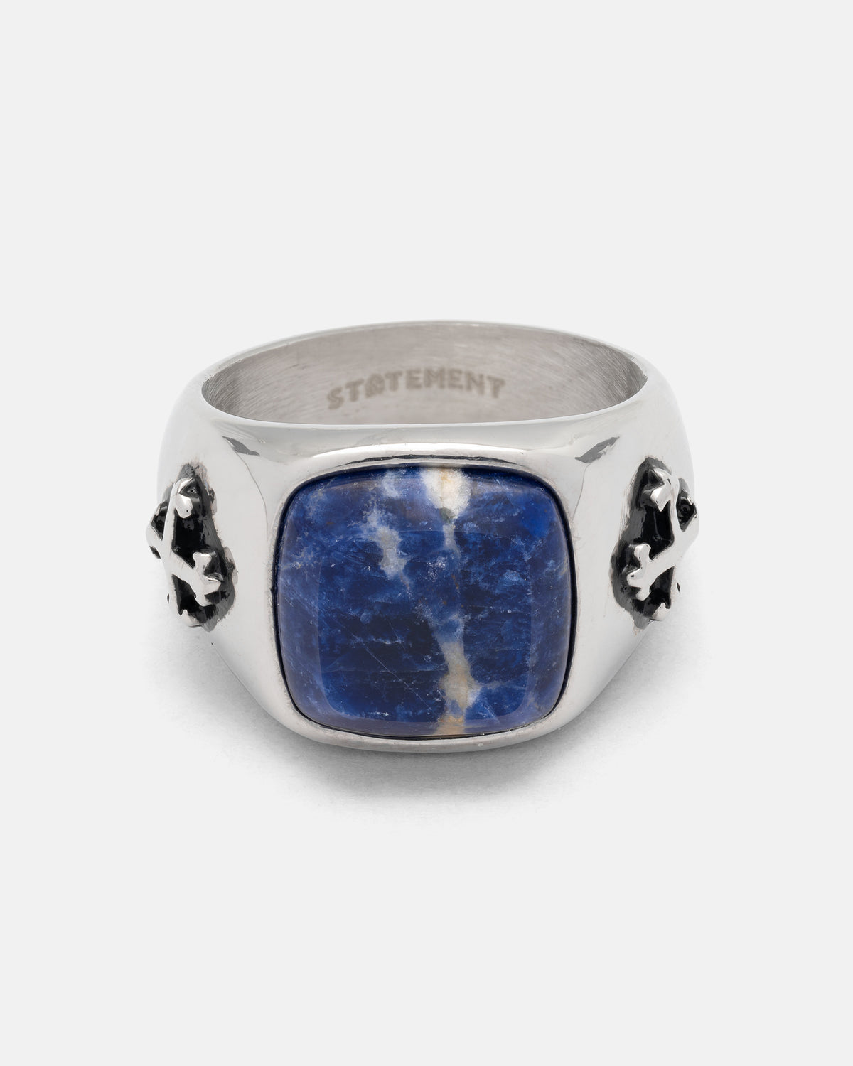 Statement Collective Sodalite Stone Ring featuring a rectangular blue sodalite stone set in silver with ornate cross-shaped side details.
