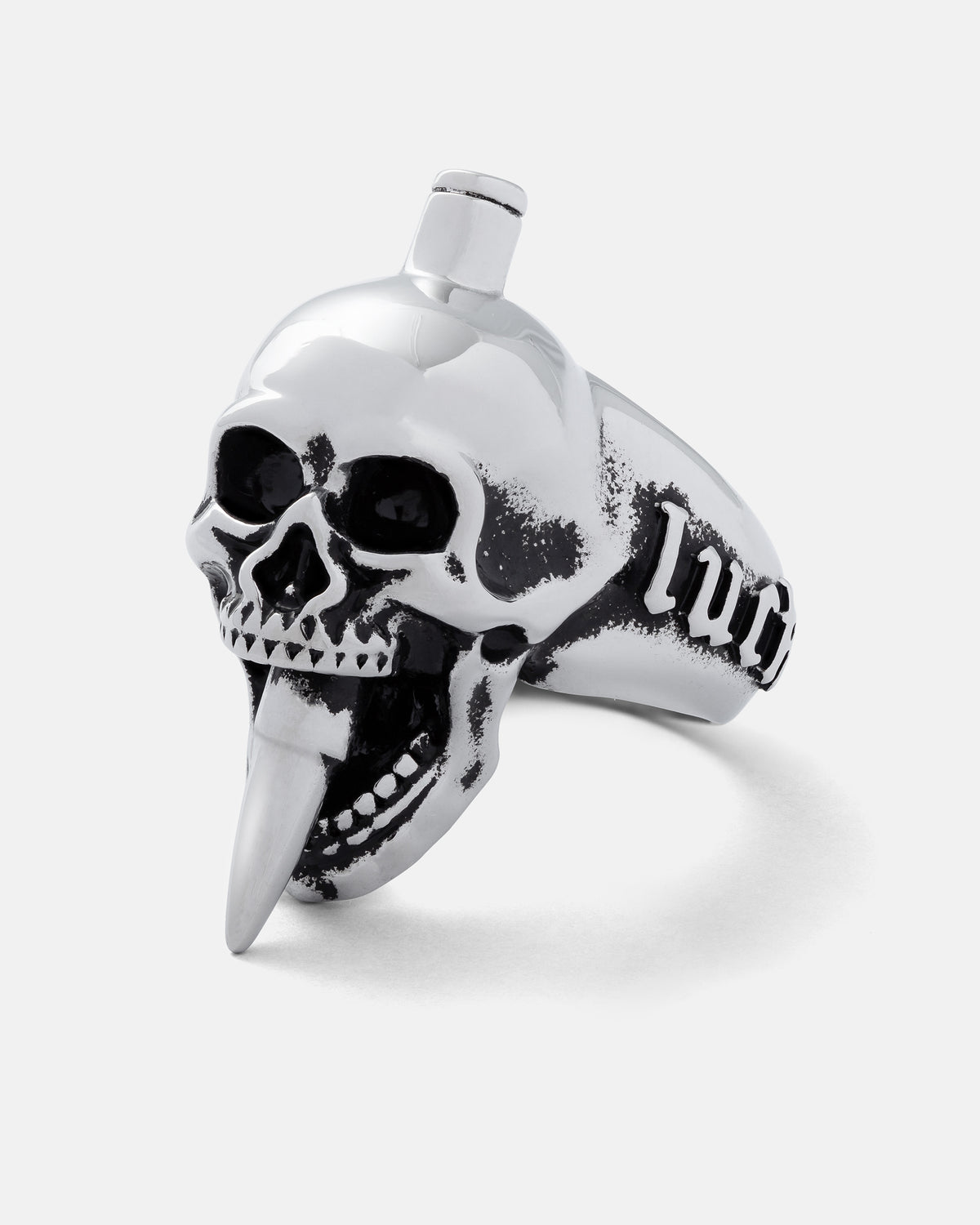 Statement Collective Bite The Bullet stainless steel ring featuring a skull biting down on a bullet, with the word LUCK engraved on the side.