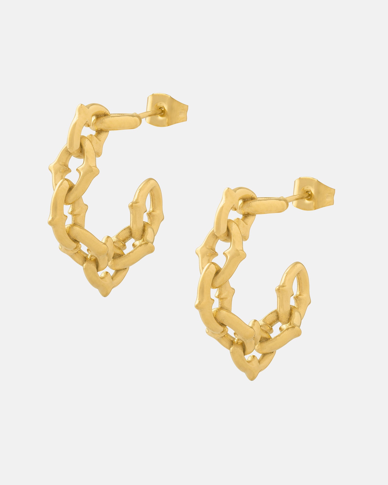 The Cathedral" Hoop Earrings (Gold) are 18k gold-plated hoops featuring a textured, bamboo-inspired design, shown on a plain white background.