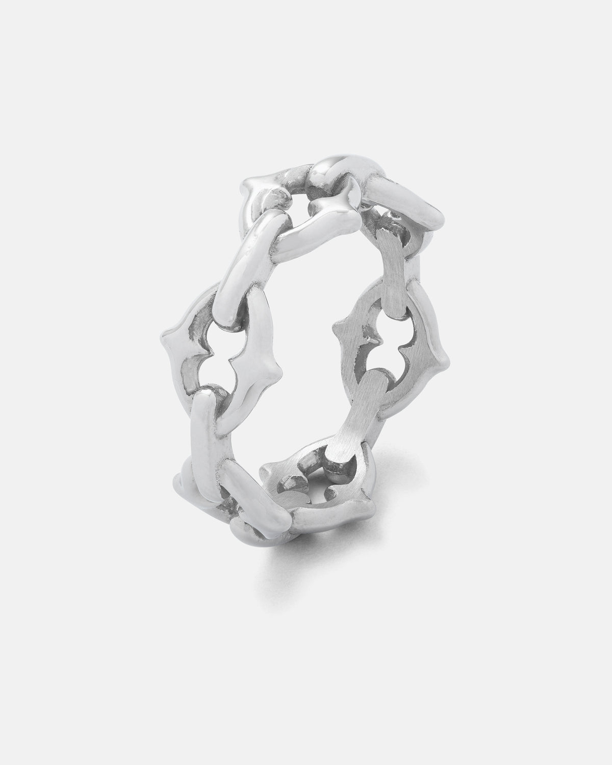 The “The Cathedral” Spiked Ring by Statement Collective features a silver spiked link design with a chain motif and striking star-shaped cutouts, presented against a plain white background. This gothic ring delivers a bold, edgy accent to any outfit.