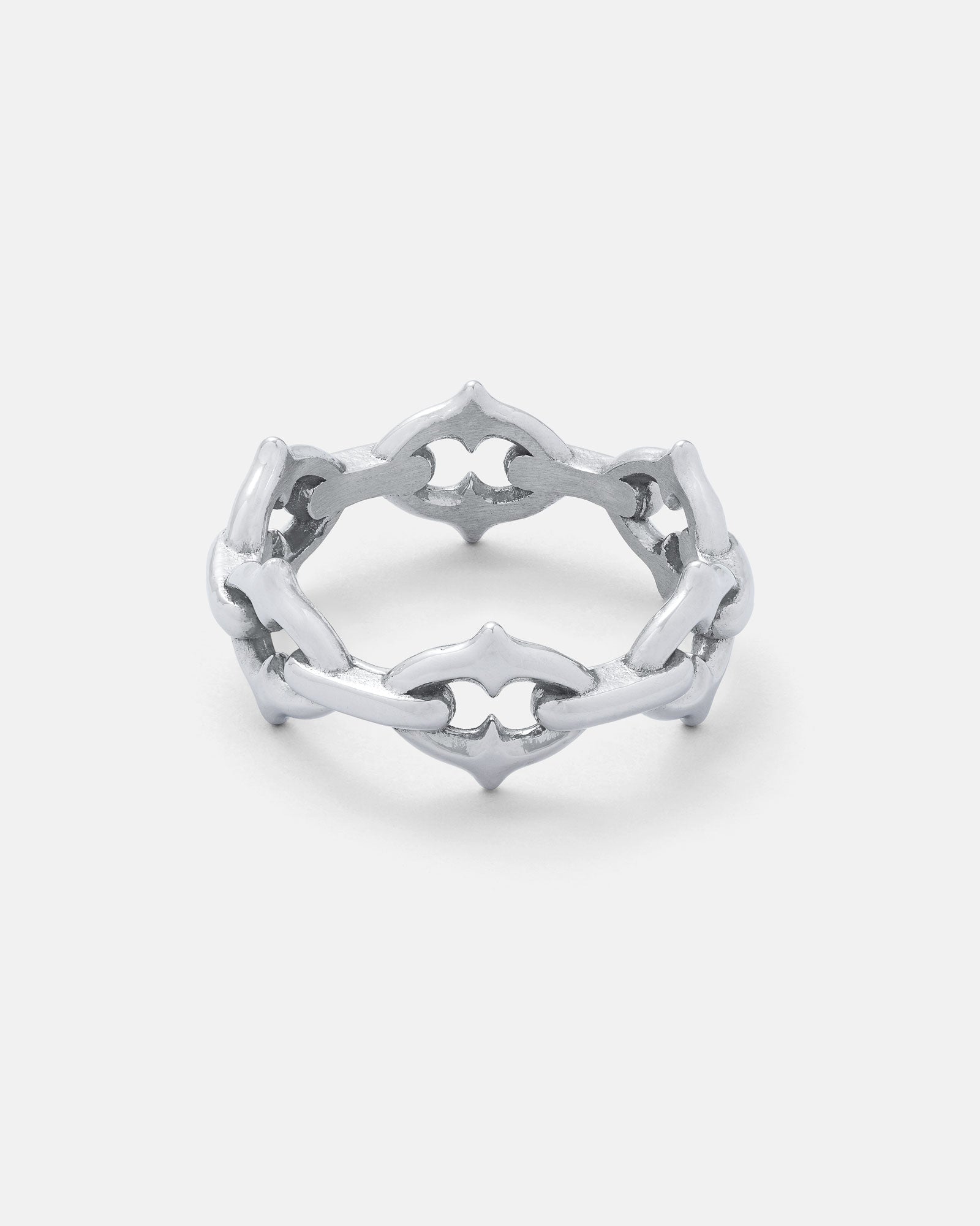 The Cathedral" Spiked Ring is a stainless steel ring with interlocking, pointed geometric shapes forming an openwork, crown-like design against a plain white background.