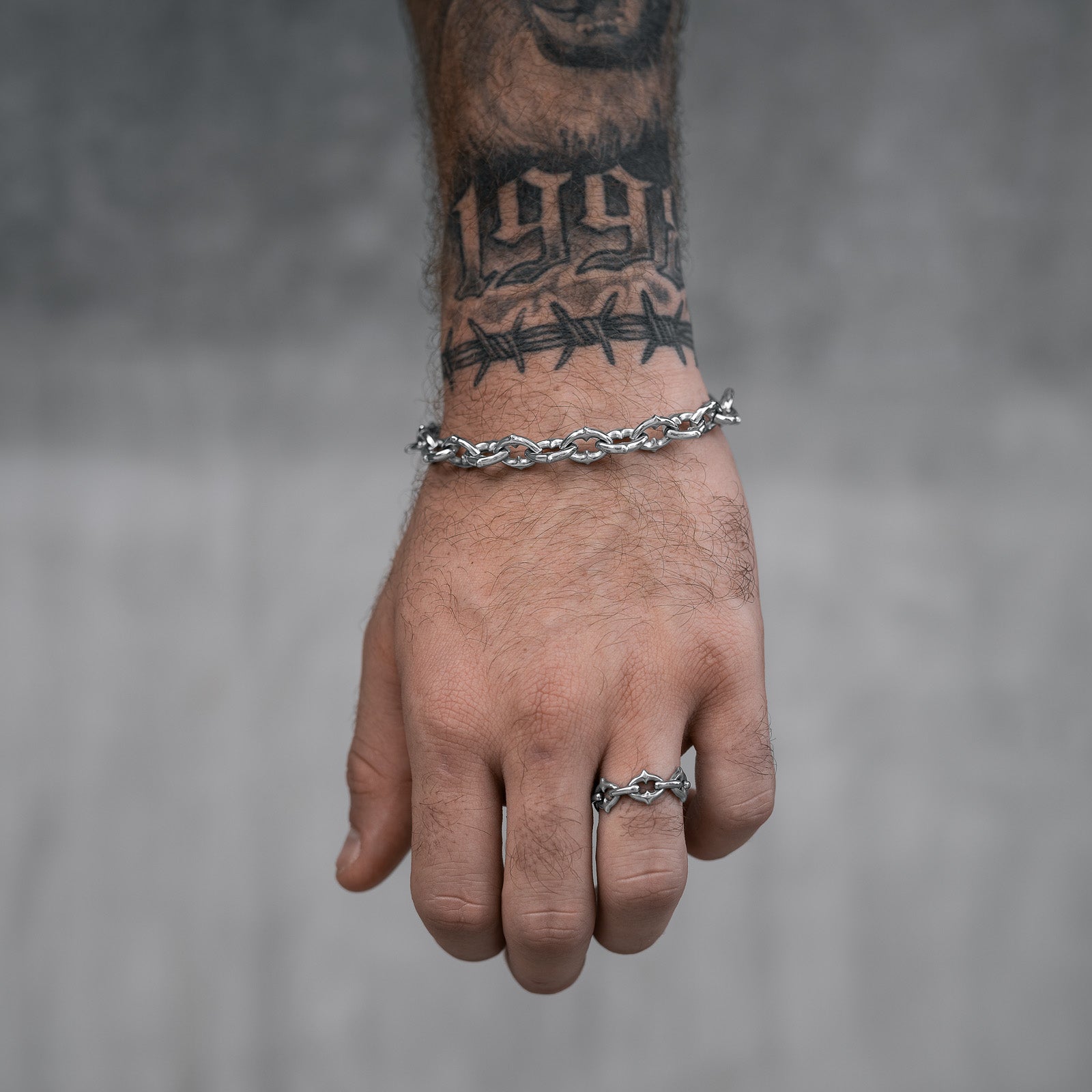 silver bracelet with spiked links