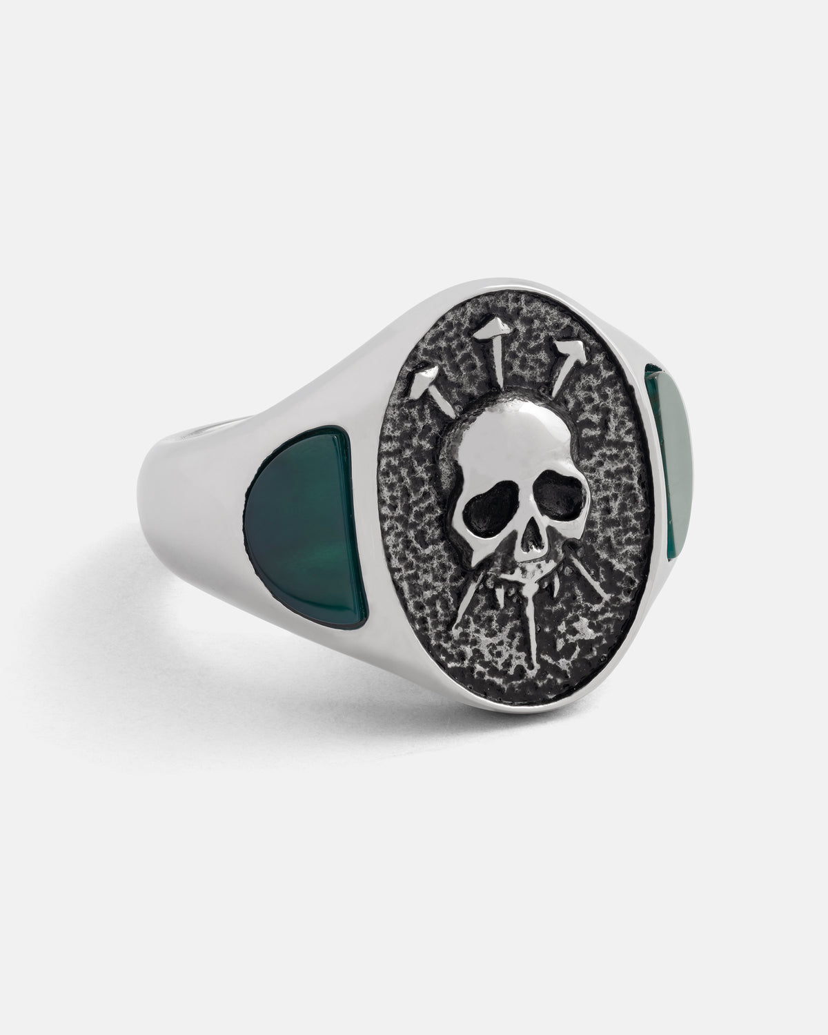 SARA_S X STATEMENT Condemned Signet Ring in silver featuring a textured face with a skull pierced by three nails, accented by dark green inlay on the sides.