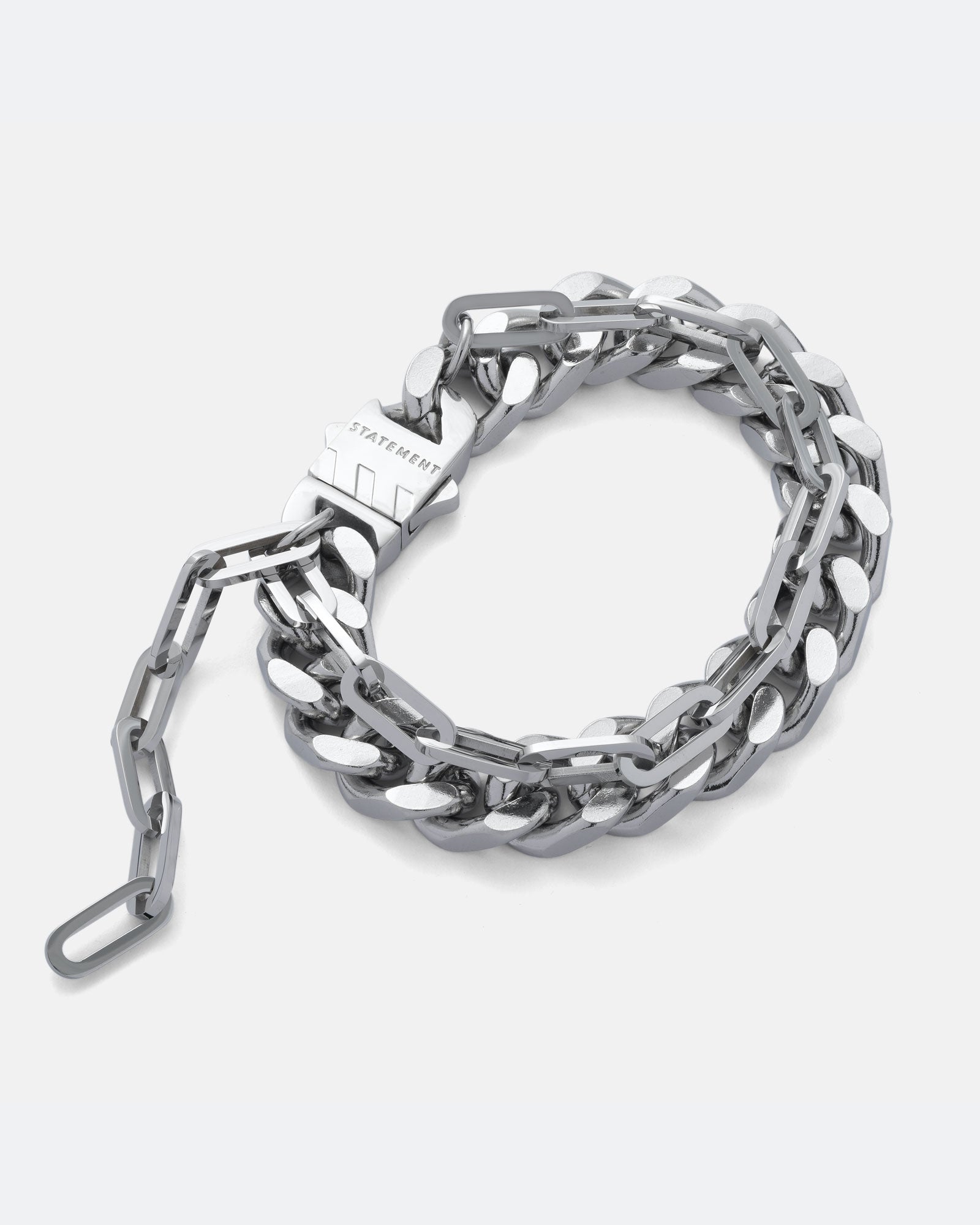 13mm Thick cuban link bracelet with thin paperclip chain attached. Doubele chain bracelet in silver on grey background.
