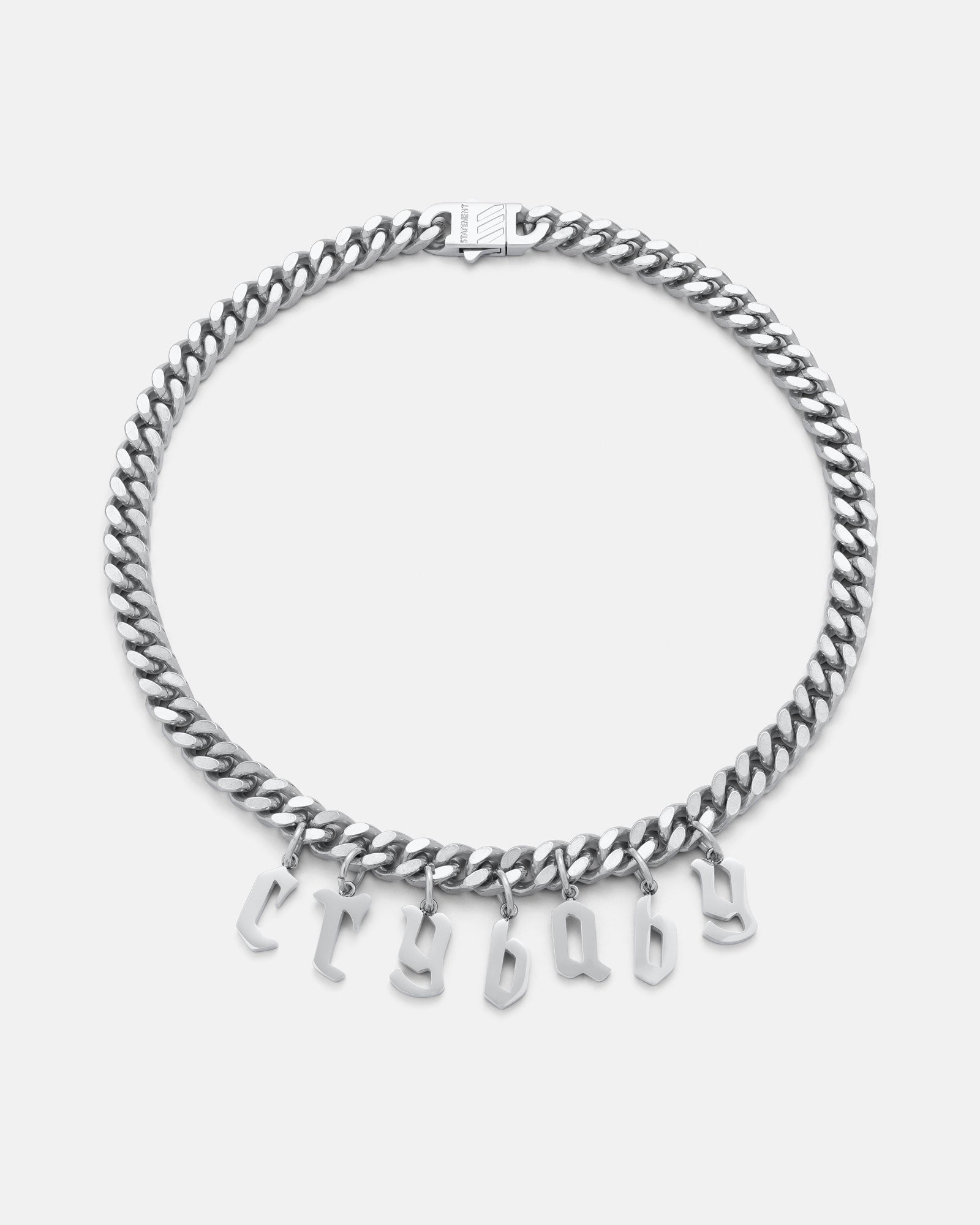 Silver chain necklace with letter pendants on a white background