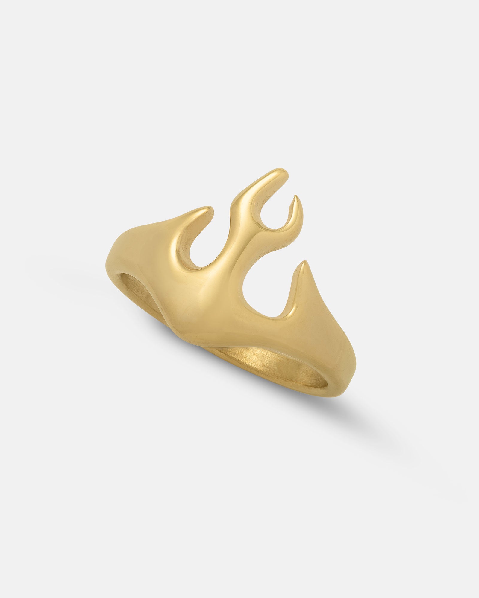 The Flame Ring (Gold) features a smooth, curved design inspired by flickering fire. Crafted in 18k gold, this bold statement piece stands out beautifully against a plain white background.