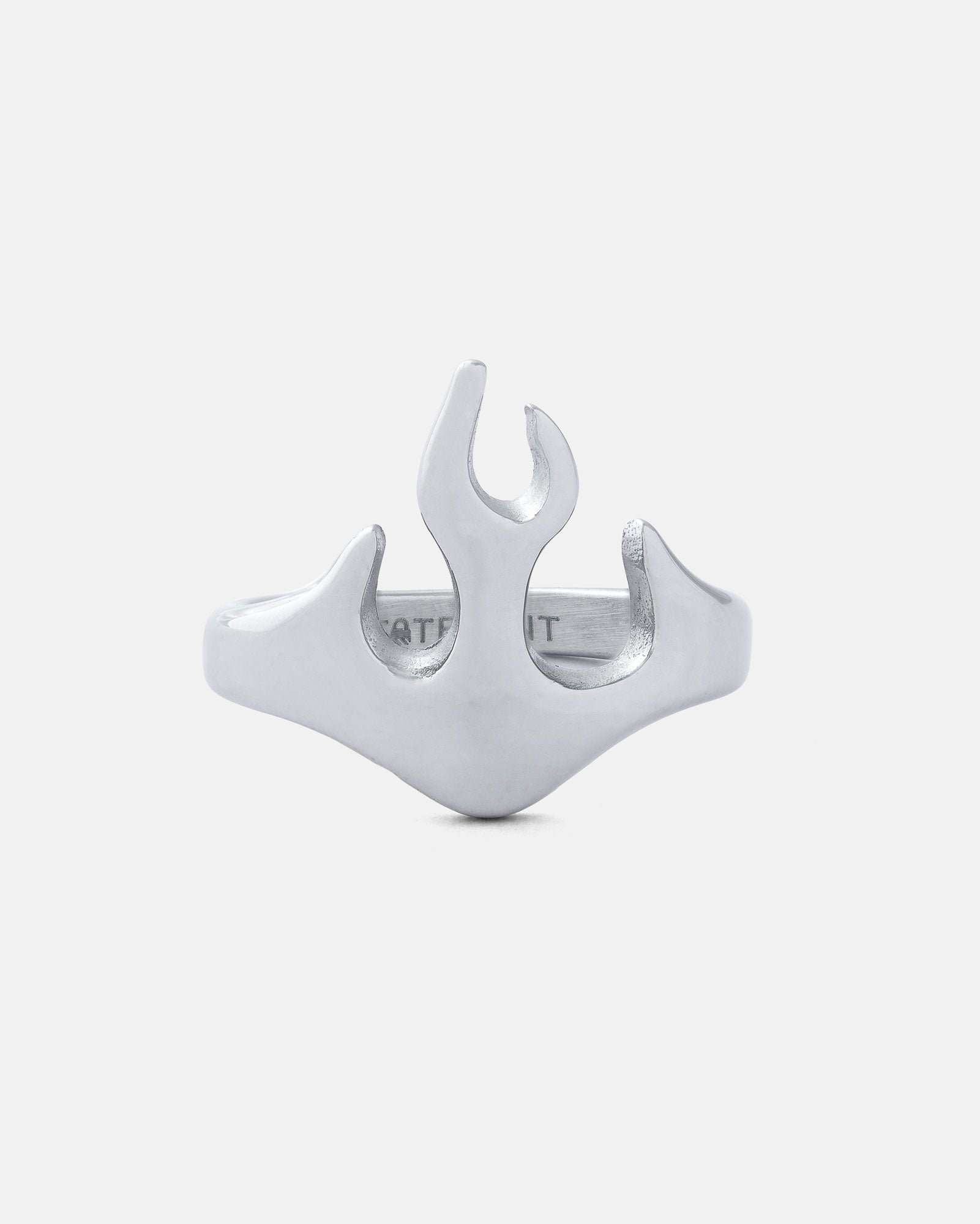 The Flame Ring features a unique, abstract silver flame design crafted in stainless steel, set against a plain white background—the perfect streetwear accessory.
