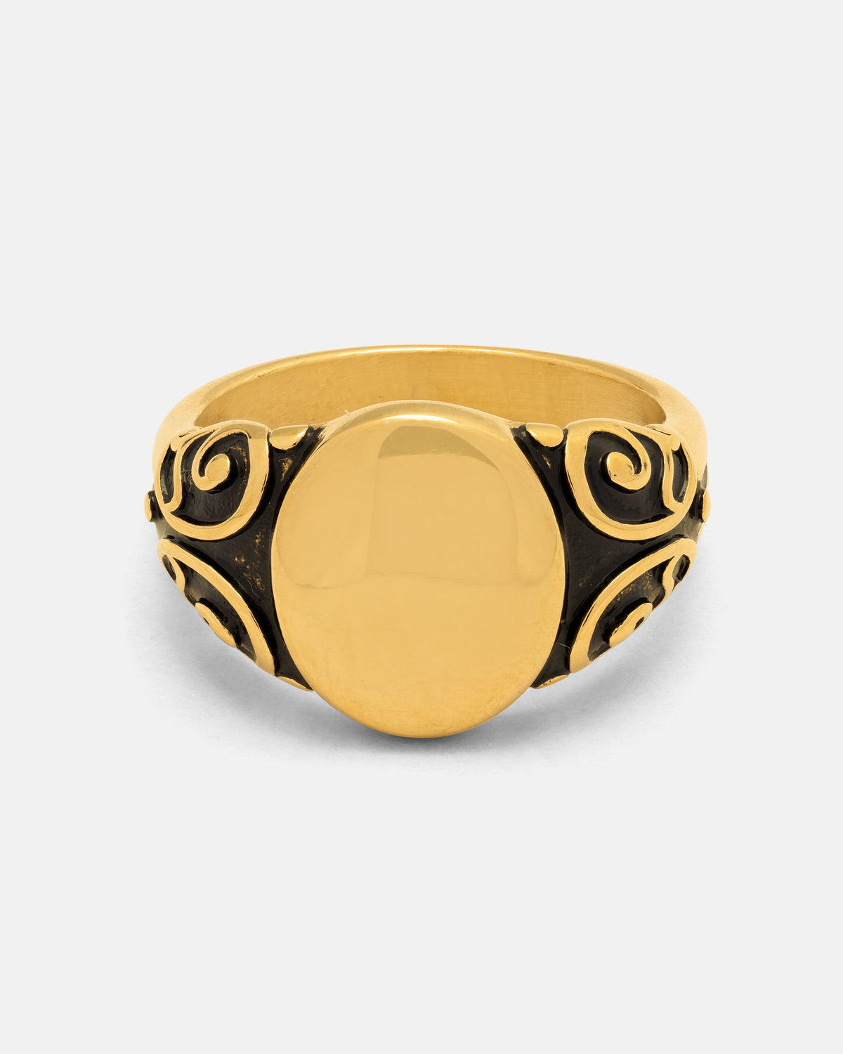 The Statement Collective Mini Oval Scroll Signet Ring (Gold) is an 18k gold signet ring showcasing a smooth, oval-shaped center highlighted by intricate black scrollwork on each side, presented against a simple light gray background.