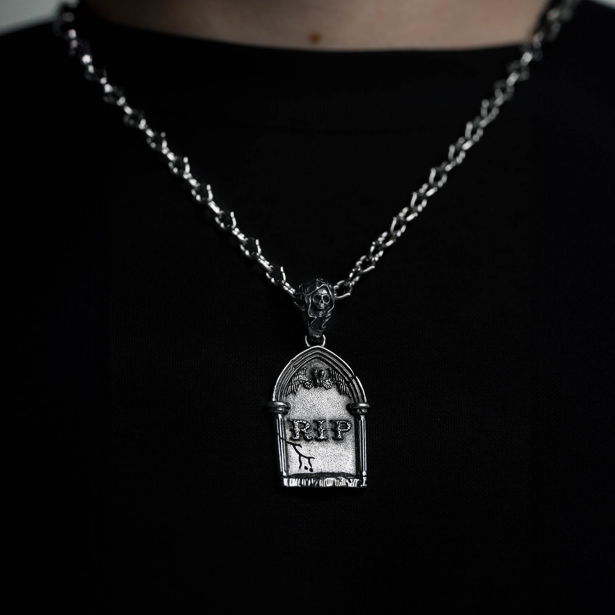 silver Gravestone pendant with Reaper Bale on a cable link chain, on male model with black t shirt