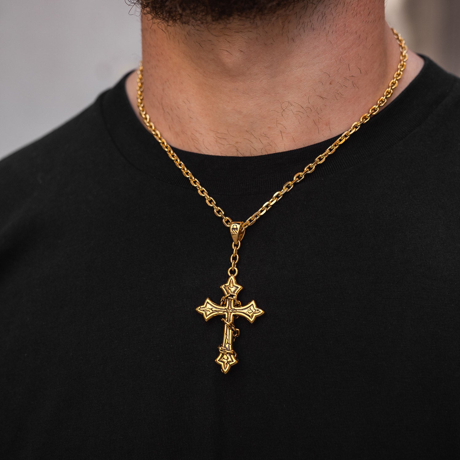gold cross pendant necklace on chain by statement