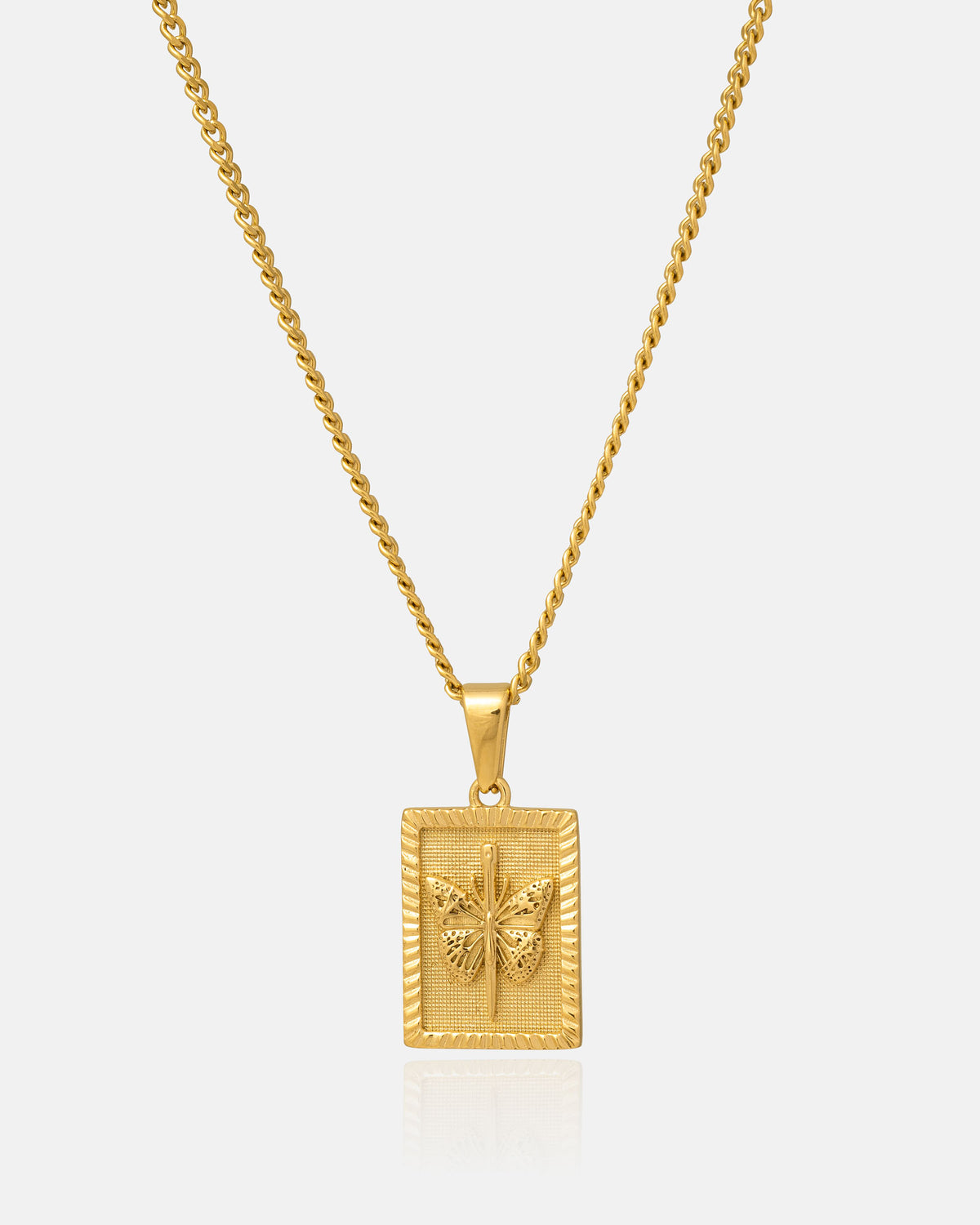Introducing the Mini Butterfly Tag Pendant (Gold) by Statement Collective—a hypoallergenic 18k gold necklace featuring a rectangular pendant with a detailed butterfly motif at its center, elegantly showcased against a plain white background. Designed for both sophistication and comfort, this necklace is ideal for everyday wear.
