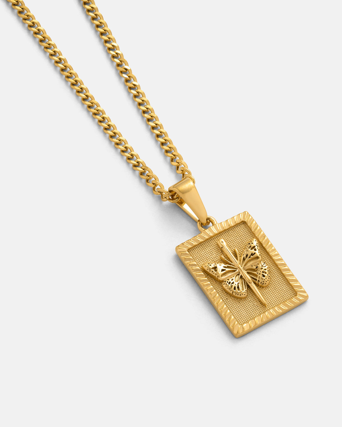 Introducing the Mini Butterfly Tag Pendant (Gold) by Statement Collective—a hypoallergenic 18k gold necklace featuring a rectangular padlock-style pendant with an intricately detailed butterfly design in relief against a textured background, elegantly showcased on a plain light surface.