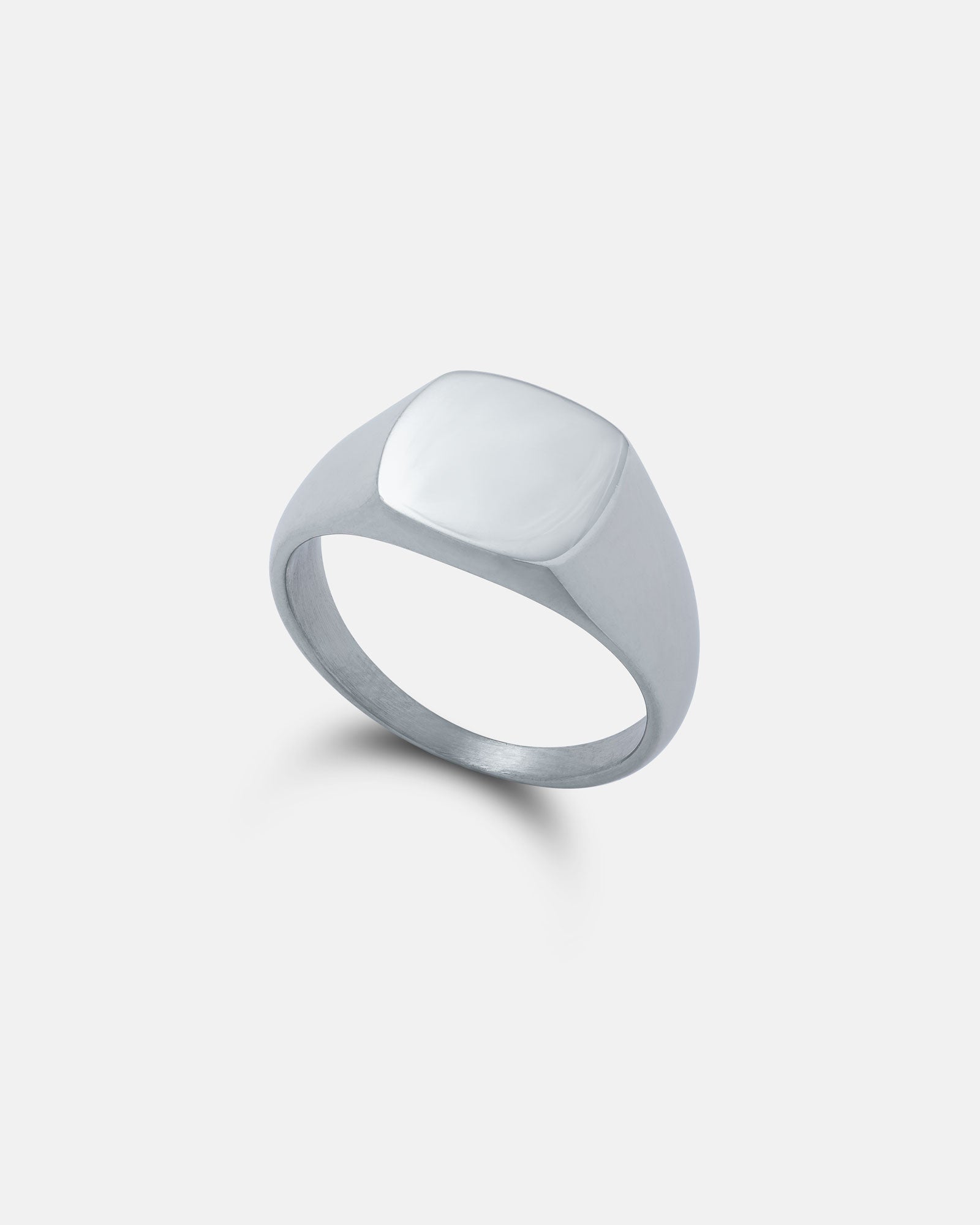 subtle mens signet ring on white background by statement collective