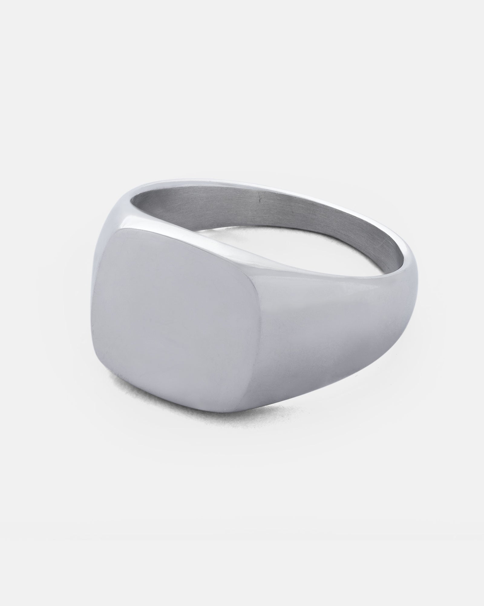 subtle mens signet ring in stainless steel on white background by statement collective