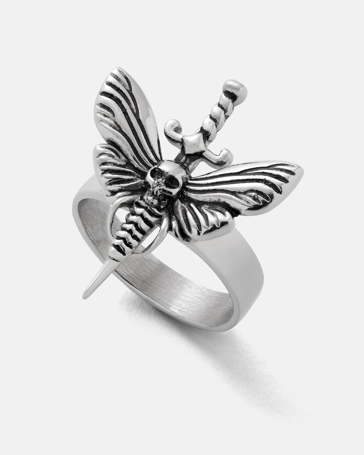 A stainless steel Death’s Head Moth Ring featuring a moth with a skull on its thorax and a dagger extending through its body.