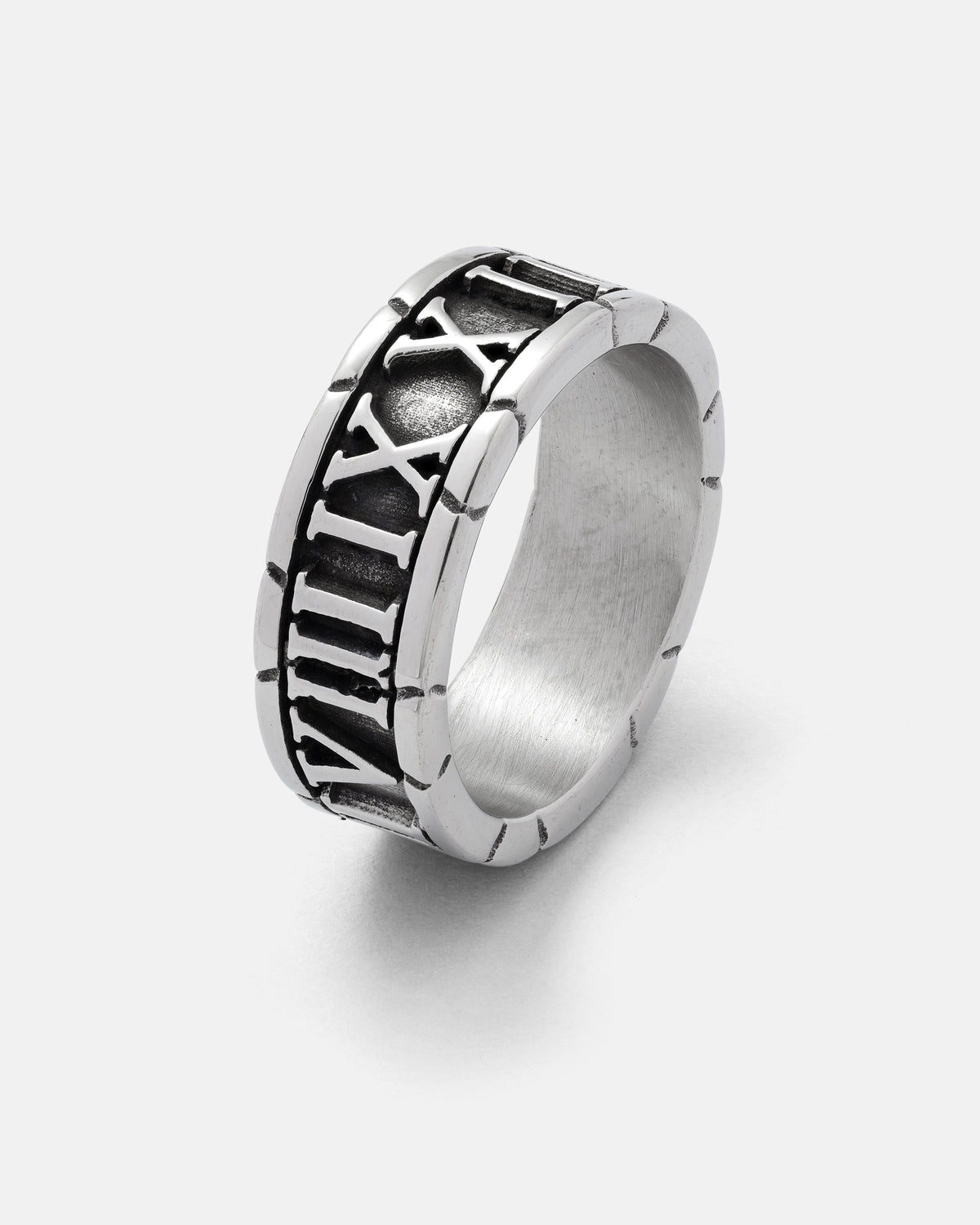 Introducing the Numerals Ring by Statement Collective—a stainless steel band engraved with Roman numerals, accentuated by a subtly oxidized, darkened backdrop that makes each number stand out. The ring features polished, smooth outer edges, making it an ideal stacking band for a modern and layered aesthetic.