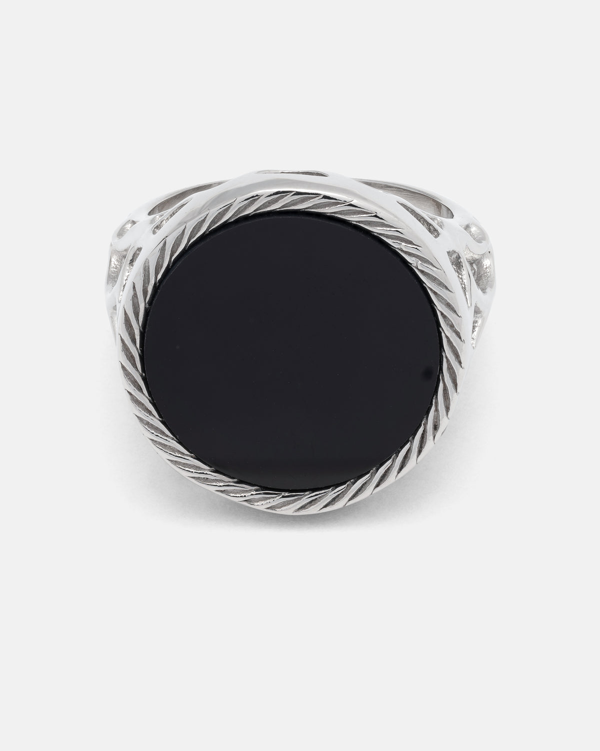 Onyx Sovereign Ring featuring a large, round black agate stone set in a twisted silver metal frame.