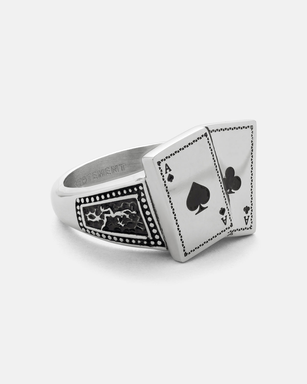 Pocket Aces Ring by Statement Collective, a silver macabre jewellery ring featuring two overlapping playing cards, the Ace of Spades and the Ace of Clubs, with textured decorative stainless steel side detailing.