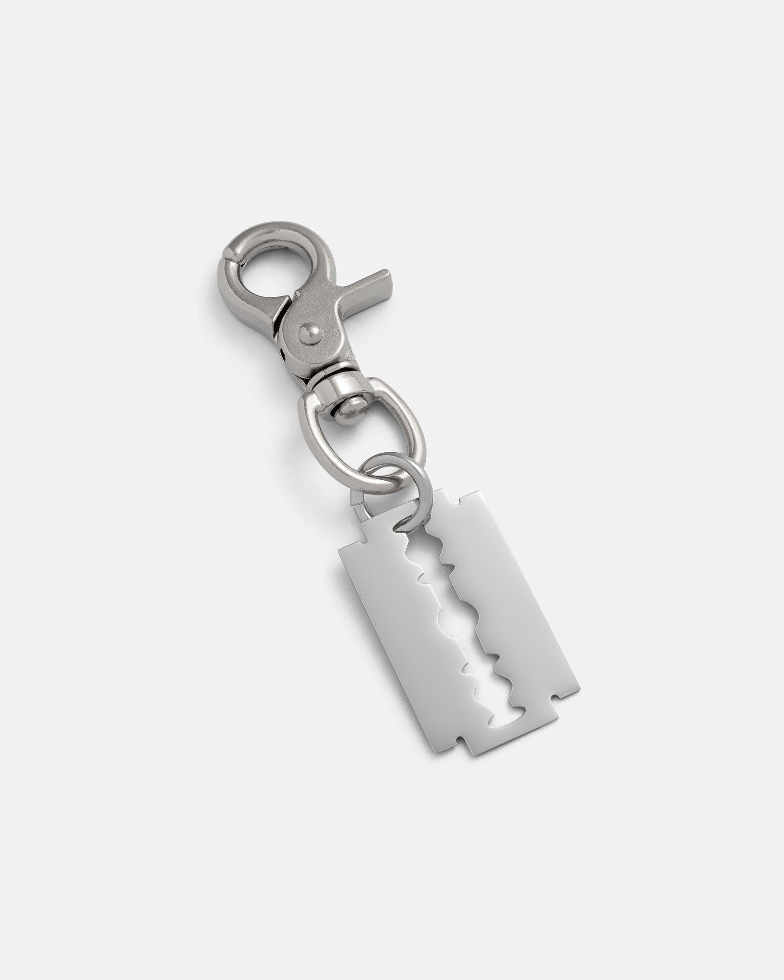The Razor Blade Belt Clip is a metal keychain with a clasp and a stainless steel double-edged razor blade pendant, ideal for alternative fashion, shown on a plain white background.