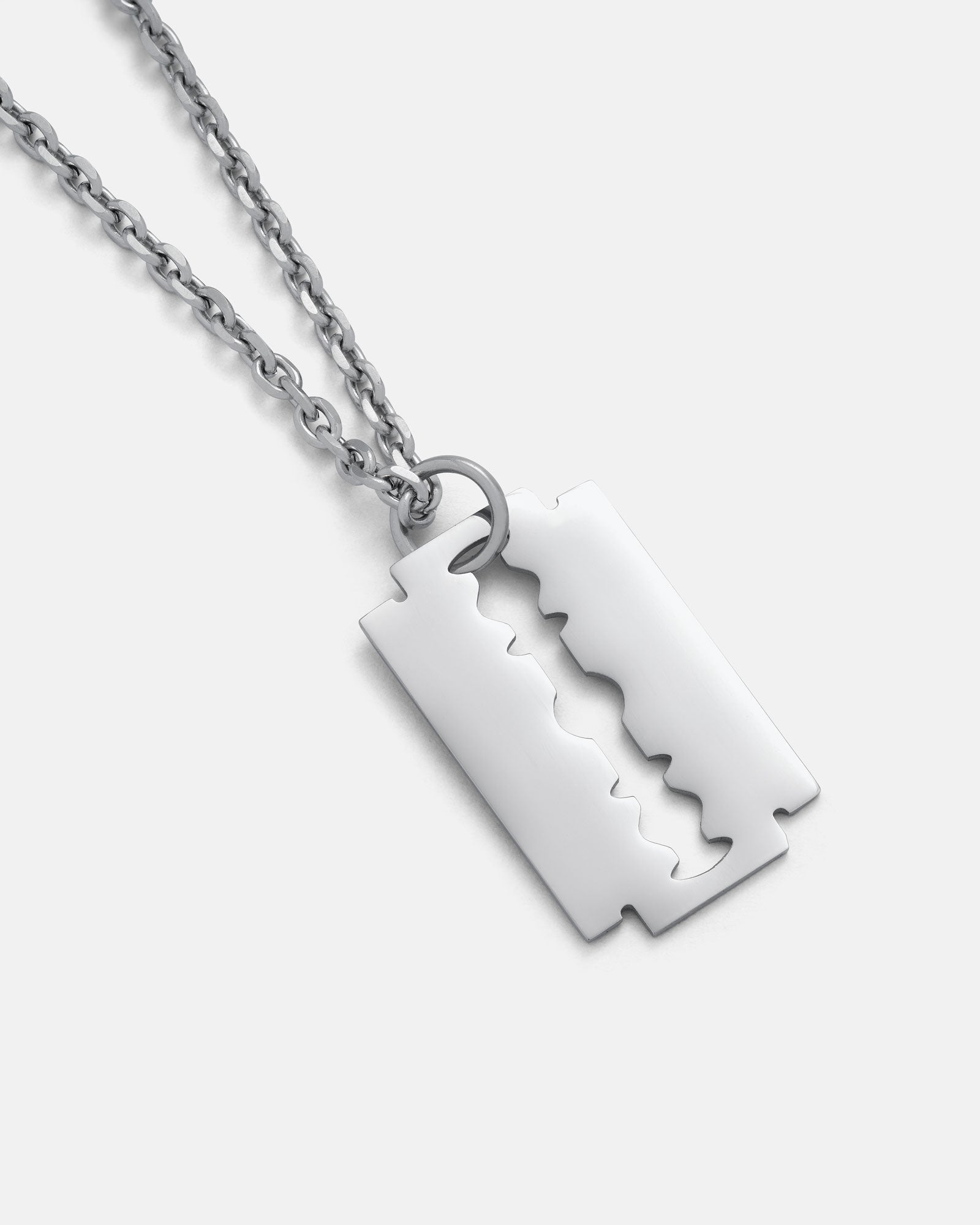 The Razor Blade Pendant is a silver chain necklace with a stainless steel double-edged razor blade pendant, shown on a plain light background—ideal for fans of punk jewelry.