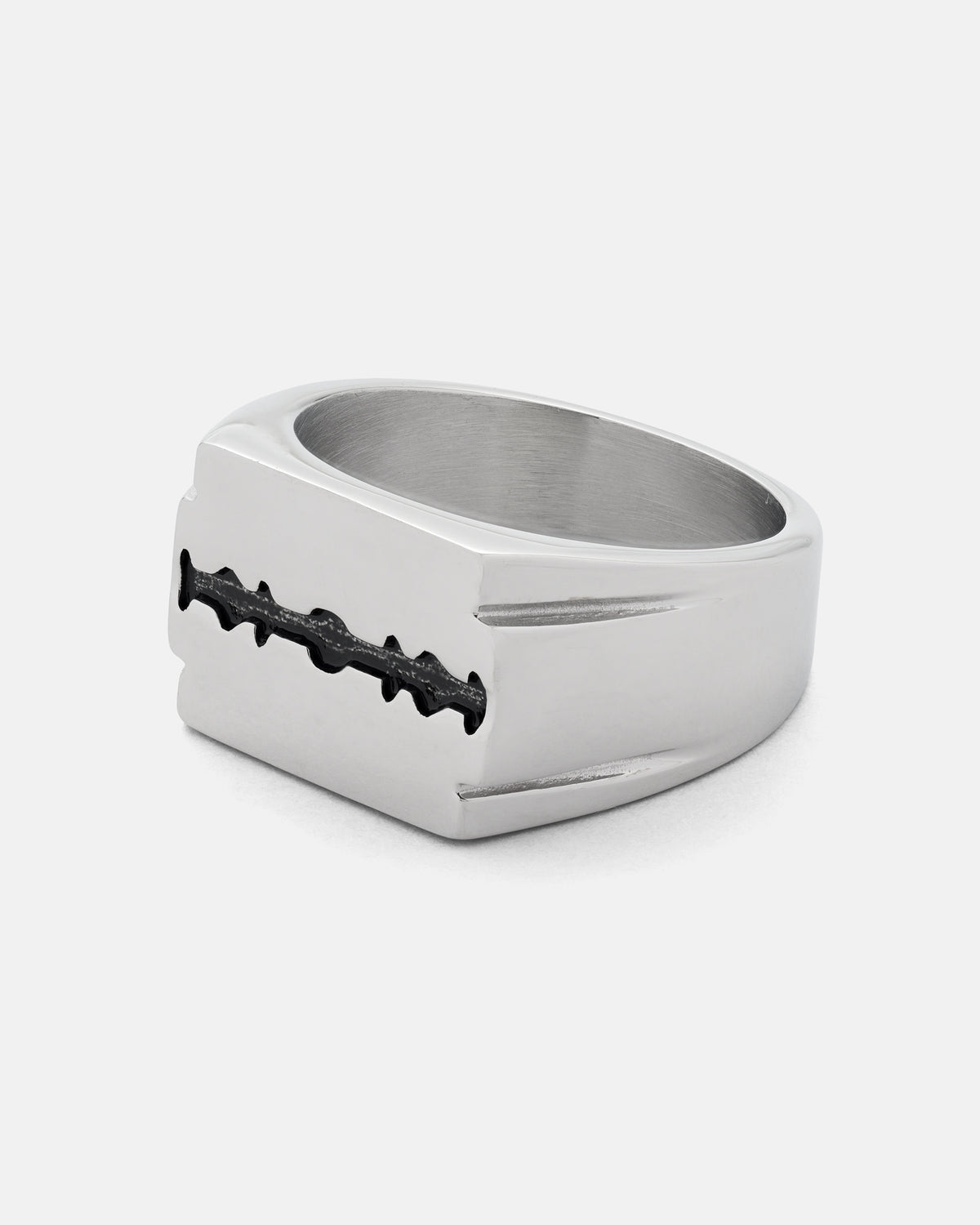 The STATEMENT Razor Blade Signet Ring features black detailing along the blade’s edge and is showcased against a plain white background—a striking piece of punk jewelry.